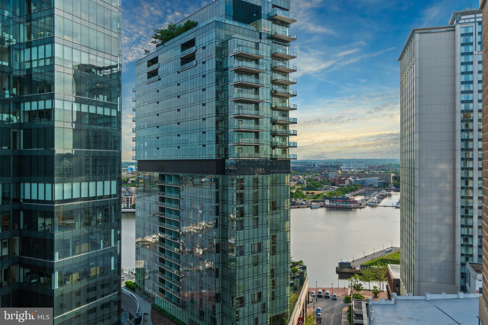 Extraordinary two bedroom two bath corner residence on the 20th floor of The Vue condominium in the heart of Harbor East. This rarely available water facing condo offers breathtaking vistas of the Patapsco River and dramatic cityscapes from every room. Featuring an open floor plan with floor-to-ceiling windows, gourmet kitchen with expansive kitchen island and a private balcony. The stunning primary suite features floor to ceiling corner windows, an oversized custom walk-in closet, and spa bath with a soaking tub, glass-enclosed shower and double bowl vanity. One covered parking space is included with this offering. The Vue condominium is located in Baltimore's prime neighborhood within steps to the finest restaurants, boutique shops, Whole Foods, Starbucks, the Inner Harbor, waterfront and nightlife. The Condo fee covers AC, heat, water, security and concierge. Take the elevator directly to the MAC gym and Harbor East Cinemas.