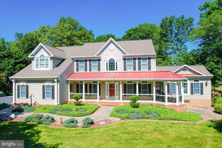 Welcome home to this stunning 4 bedroom 3.5 bathroom property with one of the best lots in sought-after Fox Valley that borders preservation land on 2 sides for incredible pastural views * The property features a total of 6 garage bays for your dream collection * Access the property by way of the winding  driveway with stone border * Extensively manicured landscaping will wow guests as they approach the large and inviting front porch with gazebo on their way to the front door * The two story foyer with gleaming hardwood flooring is light-filled and features two inviting sitting areas on either side with 9 foot ceilings, arch top windows, and crown, chair and picture moldings * A dedicated office makes working from home a delight * Some of the best property views can be found in the enlarged sunroom with cathedral ceiling, many windows with arch tops, ceramic tile flooring, recessed lights, and two ceiling fans * The 2 story formal dining room features more arch top windows, recessed lighting and a gas fireplace with floor-to-ceiling brick hearth and mantel * Partially open to the dining room is the gourmet kitchen with 42 inch cabinets, granite counters, and stainless steel appliances that include a double oven, side-by-side refrigerator, dishwasher, and microwave * The massive Silestone center island includes a JennAir cooktop, breakfast bar and storage underneath * A butlers pantry/wet bar and walk-in pantry help to keep things organized * Access to the attached 4 bay garage is through the laundry/mudroom * Also located off the kitchen is the family room addition featuring another gas fireplace, vaulted ceiling with recessed lights and ceiling fan, and a slider to the multi-level composite deck with new vinyl and aluminum porch rail system (2023) overlooking a curving patio and surrounded by the backyard and views of the preservation land beyond * The upper level landing and hallway reveal a catwalk with views of the foyer and dining room below * The primary bedroom suite features a vaulted ceiling, dual walk-in closets, sitting room with built-in seating, and a luxury bathroom with dual vanities, water closet, jetted soaking tub and a stand-alone shower * Bedroom 4 features an ensuite bathroom for privacy and the other two bedrooms share a guest/hall bathroom with dual vanities * The expansive unfinished basement with bath rough-in has plenty of storage and space to create the recreation room of your dreams * An additional detached two-level garage provides main level access through two bays for vehicles, lawn mowers, and big stuff while the second level provides a massive storage area for seasonal and long-term storage options * New Architectural shingle roof (2019) * Multi-zoned HVAC keeps the whole house comfy and the main furnace with upgraded Honeywell home air filtration system has been recently replaced (2022) *  No need to leave the neighborhood for fun as the subdivision has a refreshing swimming pool and combination tennis/pickleball court located just blocks away * Blue ribbon schools * Commuter convenience just off MD-32 to either 70, 29, 95, and The Parkway * Exceptional quality and charm make this home a must see!