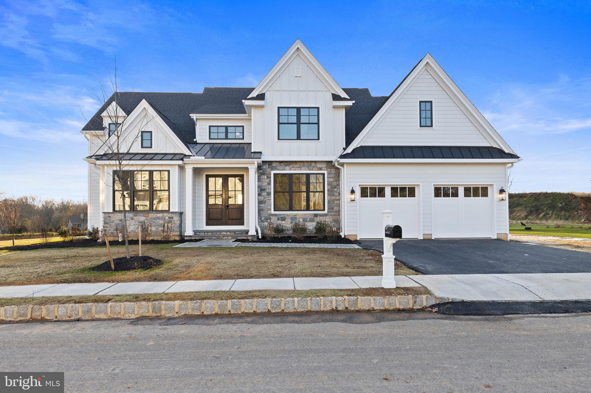 Troutbeck Farm is now 95% SOLD OUT, Introducing The Greenbriar at Troutbeck Farm an innovative, modern Main Floor Primary Bedroom plan. Troutbeck Farm is sited in bucolic Willistown Twp., within walking distance to downtown Malvern and amidst Philadelphia's historic Main Line. Troutbeck is the latest community brought to life by local, semi-custom and award winning Moser Homes. This spectacular setting of nearly 70 acres is breathtaking offering community walking trail, enchanting pond and enjoy your weekends as the HOA maintains your lawns . One could say this offering can not be duplicated, however, now available to only 34 lucky home buyers. Hallmarks of Troutbeck Farm include; Long curved tree lined entry approach, cobblestone curbs, mature perimeter property plantings and site trees, community walking trail, stylish home exteriors with Quarry Cut stone, James Hardie siding and Brick, manageable home sites backing to open space. Interior features include; Open floor plans with abundance of windows and light, 800 sq. ft of finished lower level living space, 10' main floor ceilings, oversized baseboards, solid interior doors, moldings to include crown and Adams casing at all windows and cased openings, beam ceiling in the family room, bookcase at the fireplace, private main floor study, butler pantry, generous mudrooms, wide plank engineered hardwood flooring on the main level, 3 story open staircase, Local Chester County Kitchen with Bosch SS appliance package with 6 burner commercial cook top and french door refrigerator, lavish 5 piece primary bath with dual sinks and free standing tub and much much more! At Moser Homes customization is welcomed and encouraged, we love watching your dream home come to life. Work with our local craftsman, vendors and trade partners. Troutbeck offers an incredible location, close proximity to PHL International Airport, Regional and Amtrak services, major roadways and dining, shopping and entertainment destinations from, Phila., The Main Line and West Chester areas making this a true Town and Country lifestyle! (Photos of the Greenbriar shown may feature custom options not included in the standard specifications.)
