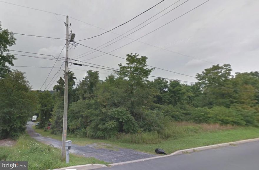 Build your dream home on this beautiful 3.57 acre lot convenient to tons of amenities.  Trailor removal included in price. Bring your own builder.  Potential opportunity to earn extra income by renting out billboard space along the highway.