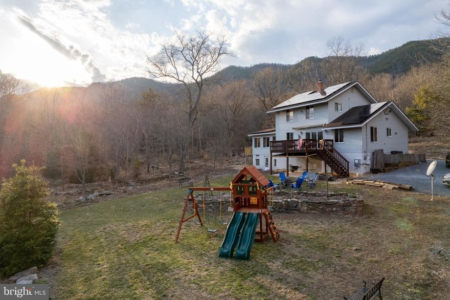 Whether you're seeking a private mountain retreat, an income-producing short-term rental, or a property with future development potential, opportunities like this in the Shenandoah Valley are increasingly rare.

———  HOUSE FEATURES YOU’LL LOVE  ———
➤ 21.35 acres of land, a rare acreage size to find ➤ Custom-built energy-efficient country home ➤ Extra Large Marvin Sliding Windows allowing you to enjoy cool summer breezes, scenic mountain views, vibrant fall colors, and the peaceful surroundings of your private retreat ➤ FULLY PAID-OFF SOLAR SYSTEM helping significantly reduce electricity costs ➤ Whole-house water filtration system ➤ Whole-house propane generator providing reliable backup electricity ➤ Elegant Vermont Castings Defiant wood stove ➤ Approximately 1,678 feet of boundary adjoining the George Washington National Forest ➤ Long private driveway offering privacy and ample parking for at least 6 vehicles ➤ The larger of the two HVAC systems was replaced in 2022 and remains covered under a 10-year limited manufacturer warranty ➤ New drain field line work completed in 2023 ➤ Water pump replaced in 2025 ➤ New Hot Tub installed in 2023.

——— INVESTMENT & DEVELOPMENT POTENTIAL———
★ The 21.35 acres have already been subdivided into two parcels: 14.619 acres with the existing home, and 6.727 acres adjacent parcel. Seller is willing to retain the 6.727-acre parcel, offering buyers the option to purchase the home on 14.619 acres at a reduced price ★ Conventional 3-bedroom septic permit already approved for the adjacent 6.727-acre parcel, separate from the existing septic system serving the home on the 14.619-acre parcel ★ Seller has completed preliminary work toward further subdivision planning and land development. This may offer potential value for buyers exploring future development or subdivision opportunities, subject to county approvals. Supporting survey and planning documentation available upon request ★ Civil engineering work completed identifying potential septic/drainfield locations for four proposed subdivision lots, supporting the possibility of up to eight dwellings, subject to county approvals ★ Property has been operated as a Short Term Rental (STR) approximately 50% of the time, with the remaining time used for personal enjoyment. Current gross annual STR revenue approx $60,000 ★ Furniture conveys, making this a Turn-Key Property, And A Turn-Key Short Term Rental (AirBnb, VRBO) opportunity. 

——— LOCATION & OUTDOOR LIFESTYLE ———
✦ Convenient access to Luray Caverns, Shenandoah National Park, Skyline Drive, and downtown Luray ✦ Multiple public access points to the South Fork of the Shenandoah River for boating, floating, and fishing. ✦ Near popular hiking destinations including Kennedy Peak, Strickler Knob, and Duncan Knob. ✦ Property borders the George Washington National Forest, offering exceptional privacy and direct access to nature, with wildlife sightings including deer, turkey, and a variety of birds. ✦ Perfect for hikers, hunters, kayakers, anglers, bird watchers, moon gazers, fall foliage lovers, and anyone seeking a peaceful retreat surrounded by nature.
 
——— Property includes a level of upgrades rarely found together in comparable properties:  whole-house water filtration system, paid-off solar system, alternate backup energy, premium features such as Marvin windows, Vermont Casting Stove etc.

——— Experience the best of Shenandoah Valley living with unmatched privacy, scenic mountain surroundings. Properties offering this rare combination of 21.35 acres, STR income potential, future subdivision possibilities, and land bordering the George Washington National Forest rarely come to market.

MAKE IT YOURS — schedule your showing today. Active Airbnb property; showings by request. 

Airbnb URL: https://www.airbnb.co.in/rooms/906714613841447852?source_impression_id=p3_1774988076_P35rKlWlCvcSHYVN
