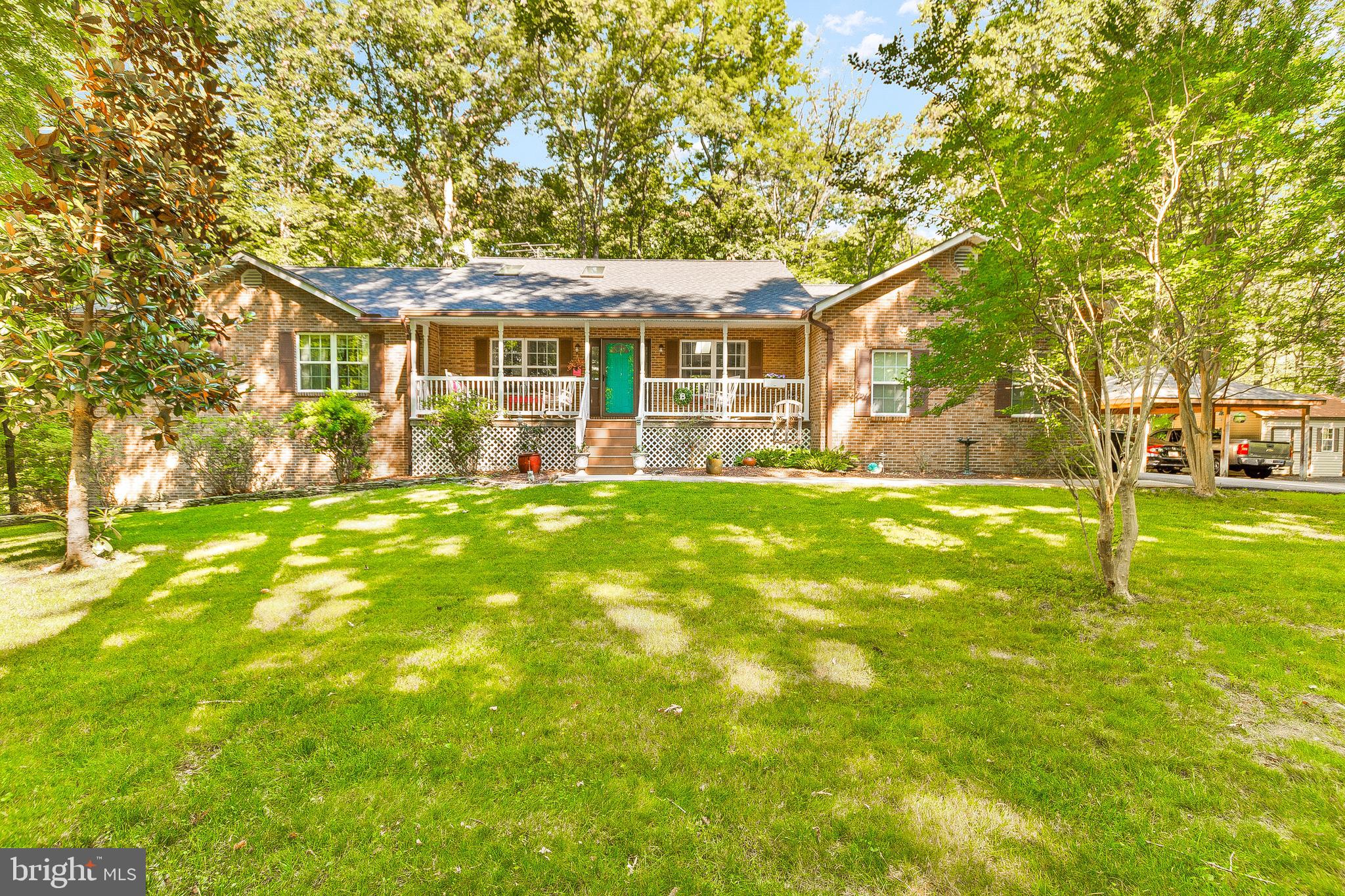 Disappear Down Your Long Winding Driveway Into Your Private Oasis On Just Shy Of 4 Wooded Acres Where You Can Enjoy The Beauty & Sounds Of Nature While Still Living Just Minutes From DC. Single Level Living At Its Finest In This Massive Rambler With An Open Concept Layout Upstairs. Enjoy Over 2k Of Finished Sqft Upstairs & Almost 2k Below Giving Plenty Of Room For Potential In-Law Suite With Separate Bedroom +Full Bath In The Basement. Outside There Is A Huge Deck, Garden & Picturesque Landscaping. Your Favorite Room Will Likely Be The Newly Built Sunroom Off The Master With Windows Surrounding You Making The Perfect Work From Home Spot For Nature Lovers. This Home Is Priced WAY Below Appraisal For A Fast Sale +ALL NEW LAMINATE FLOORS BEING INSTALLED DOWNSTAIRS THIS WEEK! The GPS Will Not Get You There, Follow The Signs. This One Won't Last So Come See It Before It's Gone...