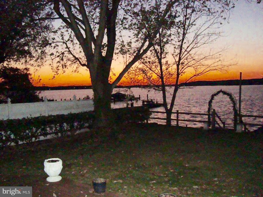 WATER FRONT RANCHER WITH MAGNIFICENT VIEWS!! Living Room panoramic views of water, plenty of storage, 2 Bay Garage used as add'l liv space, 3 Bay Carport, Driveway 3 years old, Wood stove heats entire house,500 Gallon Propane tank (owned), 150 foot dock. Boaters Paradise! Potential to make 1 additional bathroom.  Additional 1.84 ac building lot(s) across street for sale HR9996052.