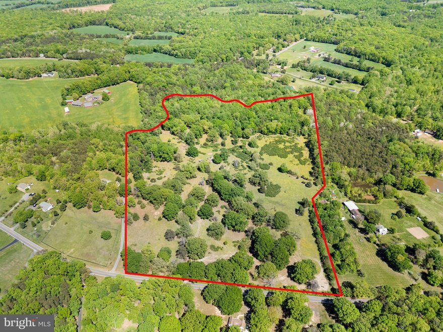 Hard to find incredible opportunity to purchase over 35+ acres*Property has been used as farmland for cattle, but would make a beautiful home site and/or farm*This mostly square lot has great road frontage*The rear of the property is bordered by a small stream*The land is a gentle mix of open space and trees