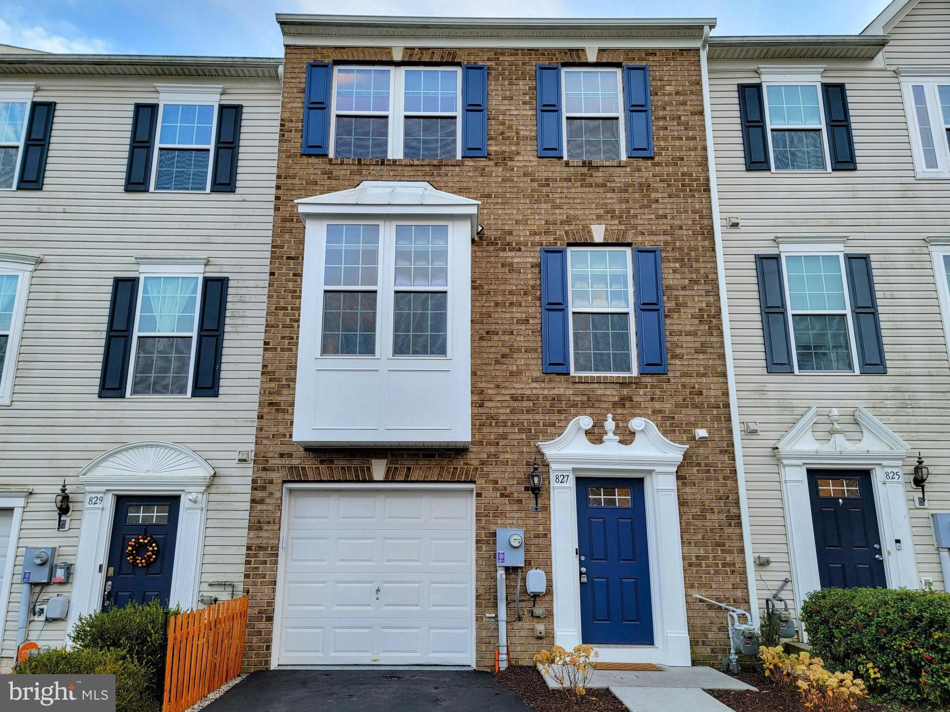 Available for move-in January 2025. 827 Blossom Drive is a beautiful, brick-faced, 1,830 finished square foot 3 bed 2 and a half bath townhome in Hanover Borough that was completely renovated in fall 2023. Completely new flooring installed in fall 2023 extends throughout the home, including professionally-refinished, sanded, stained, and polyurethane sealed real hardwood floors in Golden Oak in the living room, Mohawk luxury vinyl plank through the ground level, and luxury vinyl tile in the kitchen and dining. New paint applied in fall of 2023 extends through the entirety of the home, including all walls, trim, ceilings, doors, garage, and front façade. 9-foot ceilings extend through the main living level and the bedroom level. Brand new Whirlpool appliances throughout, including all stainless steel in the kitchen- an ultra-quiet 47dBA dishwasher with third rack, stainless electric oven/range, and stainless 36-inch wide fridge/freezer with ice and water dispenser in the door. Stainless overhead microwave and clothes washer and clothes dryer also included. New Moen kitchen faucet with incorporated sprayer, as well as in-sink garbage disposal. The kitchen features a large separate pantry with shelving, as well as brand new cabinet door and drawer pulls, which are also featured in the bathrooms. The primary bedroom features a tray ceiling, two closets with full walk-in, and an attached primary bath. The primary bath features a dual-sink vanity, soaking tub and separate shower, while the secondary bath includes a tub/shower combo and an extra linen closet. Both full baths include elongated toilets, and all baths include cushion close Kohler toilet seats. A sizeable bonus room on the first floor opens to a private, completely fenced in rear yard- the six-foot wooden privacy fence was just pressure-washed and re-stained with vinyl lattice added at the base. A full 12-foot by 12-foot patio and landscaping package completes the private backyard space. The one car garage is painted white, and the floor has been sealed with a stain resistant glossy fleck finish- it also features an electric opener with two provided remotes and keypad entry. The driveway provides private off-street parking and was seal coated in fall 2023. HVAC consistently professionally serviced. A sprinkler system extends throughout the home, as well as six just-replaced hardwired combination smoke & carbon monoxide detectors, and two fire extinguishers are provided. A Ring camera is installed on the front door for tenant’s use. Blinds are installed on all windows throughout the home, as are screens, with vertical blinds installed on sliding doors. Brand new soft white energy efficient lightbulbs installed throughout the home. Four standing lamps included at tenant’s option, as well as welcome mats. Also provided are a push mower and string trimmer and accompanying batteries, trash and recycling bin, a hose, and additional shelving. Extremely desirable location in walking distance to schools, and close proximity to an abundance of shopping and restaurants. Easy access to Hanover Borough and downtown Hanover as well as nearby parks and trails. Easy access to commuter routes such as Routes 194, 94, 116, and 216. Tenant responsible for lawn care with provided mower and trimmer, tenant pays all utilities, cats and dogs acceptable with additional pet rent and deposit on a case-by-case basis, no exotic pets. No smoking permitted in home.