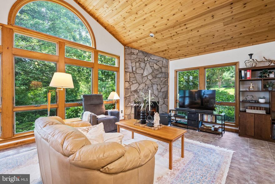 A Hidden Gem in Malvern Hill—Spacious, Stylish & So Easy to Love! Welcome to this cheerful and beautifully expanded split-foyer home on a third of an acre in the sought-after Malvern Hill neighborhood—just off Quaker Lane and mere minutes from Old Town, Del Ray, and Shirlington. With thoughtful updates, smart improvements, and plenty of personality, this is the kind of home that feels just right from the moment you step inside. *Let’s start with the heart of the home: the sun-drenched addition that creates an airy, open feel you’ll love from day one. With its dramatic vaulted ceiling, stunning floor-to-ceiling stone gas fireplace, and charming wood details, this is the space where everyone gathers—whether you’re hosting friends or just curled up with a book.  *The kitchen is fully equipped and ready for action, featuring a brand-new gas cooktop and double ovens (both installed in 2024), a microwave (2021), and a beverage cooler for your sparkling waters (or something stronger). It opens into both the great room and a formal dining area—so there’s room for casual mornings and festive dinners alike. *The main level is wonderfully livable, with three spacious bedrooms and two full baths, including a dreamy primary suite that feels like a boutique hotel. Architect-designed and custom-built in 2006, the suite includes a sunny sitting area, a spa-inspired bath with a soaking tub and separate shower, and its own private study with custom-built-ins and direct backyard access—perfect for a home office, creative studio, or peaceful retreat. *Downstairs, you’ll find a fully renovated rec room (a $65K upgrade in 2015!) with built-in bookcases, surround sound speakers, and all the space you need for movie nights, game days, or epic karaoke sessions. There’s also a versatile den/office/playroom, a third full bath (renovated in 2012), and a laundry room that was customized to make chores a breeze.  *You’ll also love the attached oversized two-car garage, which has extra cabinet storage and a workbench for weekend projects, plus entry to a self-contained climate-controlled storage room with a second full-sized fridge/freezer. The roof was replaced in 2019, and the front walk and driveway were redone in 2018 to enhance both curb appeal and functionality. *And the yard—oh, the yard! It’s a green, leafy haven for kids to play and/or adults to garden, and has only become more peaceful and shaded over the years as the trees matured. The backyard feels wonderfully private, and the deck is the perfect place for morning coffee, summer grilling, or simply listening to the birds. *Extras? You bet: Double-paned windows throughout (updated in 1997, 2006, and 2013); Three-zone HVAC (units from 2007, 2010, 2013); Whole-house surge protector (2023); Alarm system and front-door camera (2022); Pull-down attic stairs for extra storage; Two wood-burning fireplaces (untouched for decades) and one working gas fireplace for cozy evenings. *Location perks? It’s all here. Walk to Giant (yes, even in a snowstorm), bike to the Potomac River, or hop on the DASH bus (just four blocks away) to connect with the Metro at King Street. The Beltway is only 5 minutes away, making commuting or weekend getaways a breeze. *This is a home with history, heart, and room to grow—lovingly maintained and ready for its next chapter. Come see why life in Malvern Hill feels so good!