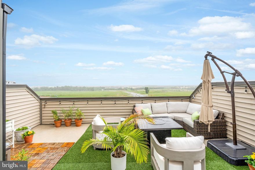 If you are looking for a move-in ready home with HGTV style and many luxurious upgrades, this property is for you!! Discover the perfect blend of style, convenience, and sophistication in this stunning condominium just steps from the Ashburn Metro. Designed for today's busy professionals, this residence offers seamless access to Washington DC, Dulles airport, Reston Town Center, and Tysons Corner Center!

To apply, go to this Rent Spree link: https://apply.link/-6w1Tao

Inside, the open-concept main level with hardwood floors, sets the stage for both everyday living and entertaining. A gourmet kitchen with a  large quartz island, 5-burner gas stove and stainless farmhouse sink flows effortlessly into the spacious dining room, wet bar, and private balcony. Upstairs features a primary suite with a double vanity and custom, walk-in closet as well as 2 more bedrooms, a large full bath, and an adorable laundry room with sink and extra cabinetry. To top it all off, there is a huge rooftop deck with striking views and room for dining, entertaining and gardening! Artificial turf and a huge umbrella make it an instant entertainment space. This luxurious townhouse-style condo is only 3 years young and in that short time, it has been transformed from a "builder-grade" condo to a custom, high-end retreat. Almost every wall has been painted with high-quality paint, the lighting has been replaced with stylish fixtures, cabinets have been added, and all hardware and faucets have been upgraded. 

Beyond your door, indulge in high-end amenities tailored to an active, social lifestyle. They include: state-of-the-art fitness center, elegant clubhouse, scenic walking and biking paths, expansive park and playground, and sparkling outdoor pool. This community is perfect for those who love to walk, socialize, or bring their dog along for the adventure. This property delivers more than a home - it's a lifestyle! Don't miss the opportunity to enjoy luxury and convenience in the heart of desirable Loudoun County, Virginia!