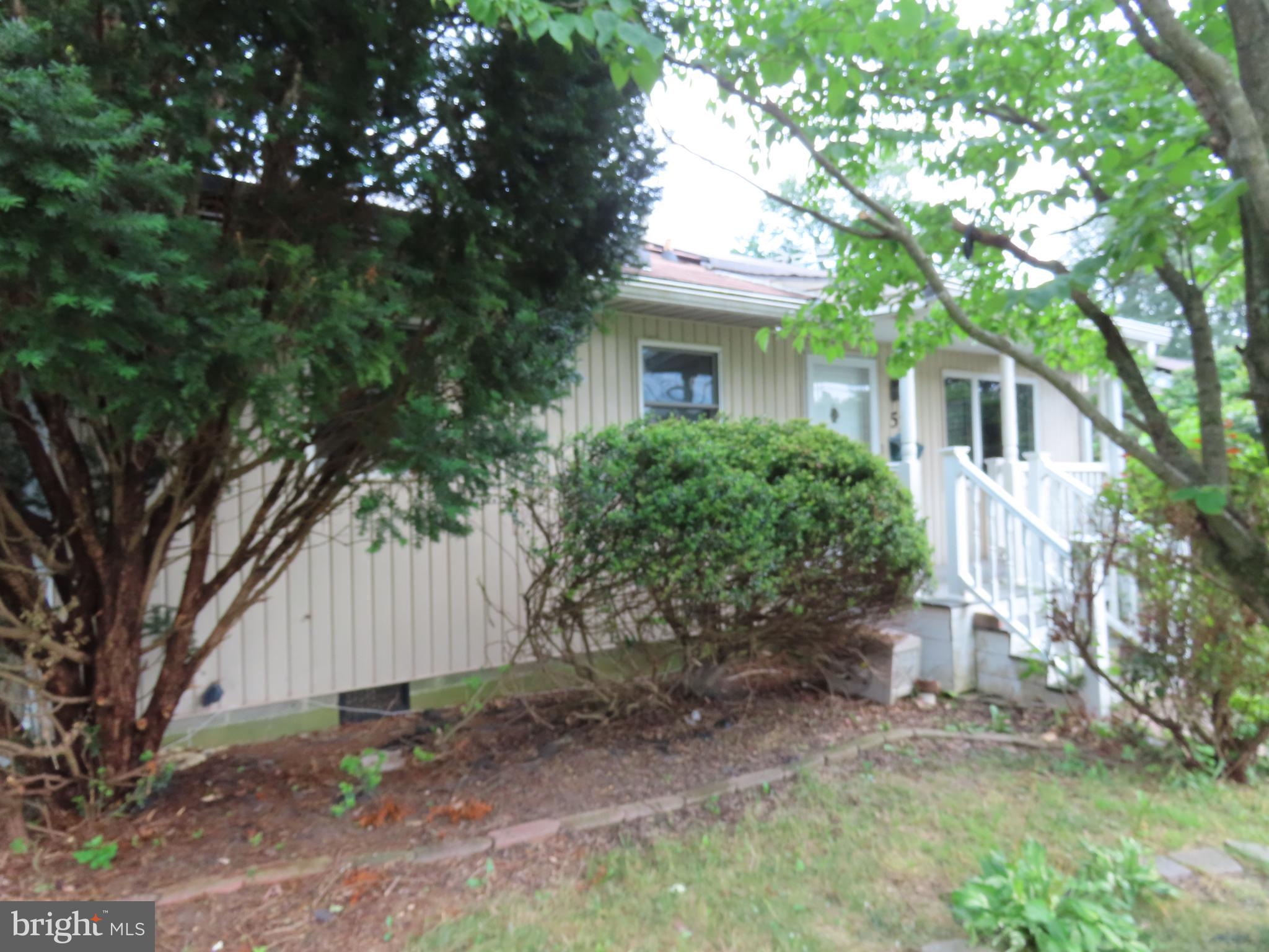 Don't let this one fool you! This is a spacious ranch home with a unique floor plan and lots of extra features. This home features lots of wood trim, a very unique L-shaped kitchen with open beams and vaulted ceiling with an adjacent laundry area, a huge family room in the rear section with exposed beams, and a master bedroom with walk-in cedar closet, vaulted ceiling and a full bath. In the back is a covered deck plus a large screened "gazebo", a pond, and an oversized 2-car tandem garage or garage/workshop, complete with a 2nd floor finished workroom. There is over 1700 sq. ft. of space in this rancher. The home is being sold in as-is condition with the price reflecting the work that needs to be done to make it shine again! Bank Approved Short Sale. Agent has Direct line to Asset Manager. All offers will have a response within 1-2 business days. No offers will be reviewed for the first 7-days so please submit Highest and Best.