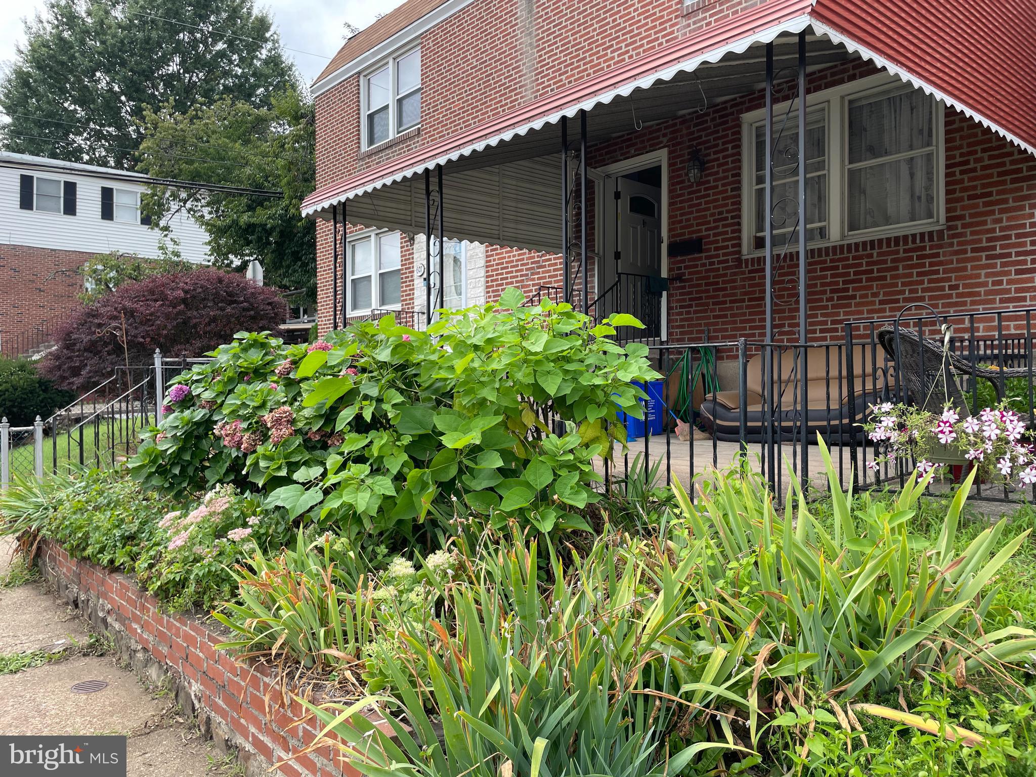 Welcome to this charming home located at the top of Green Lane! It's patiently waiting for a new occupant to fall in love with it and make it their own. Whether you prefer to move in right away or add your personal touch, this home offers endless possibilities that are entirely up to you. The front porch elevated off the street and equipped with a canopy, allows you to enjoy it in three seasons. Step into the living room, which seamlessly flows into the dining room and an L-shaped kitchen. The carpets on the second floor hide pristine original hardwood floors! The convenience of a fenced-in backyard right off the kitchen makes it perfect for hosting BBQs and outdoor gatherings or use as an extra parking space. As you explore further, you'll discover a fantastic, finished basement with a laundry area, a half bath, and an abundance of storage. Transform it into a workout room, media room, or playroom - the choice is yours! Heading upstairs, you'll find three spacious bedrooms with ample closet space, a large three-piece bathroom, and a sunny atmosphere that fills the entire floor. This home has been meticulously cared for and boasts a new Goodman Heater, New Roof, and more. Living here means easy access to Wissahickon Park for hiking, and biking. Plus, with its proximity to Henry Ave, you'll have convenient access to everything the city has to offer. Don't miss out on the opportunity to make this lovely home yours. Come and peek - you won't be disappointed!