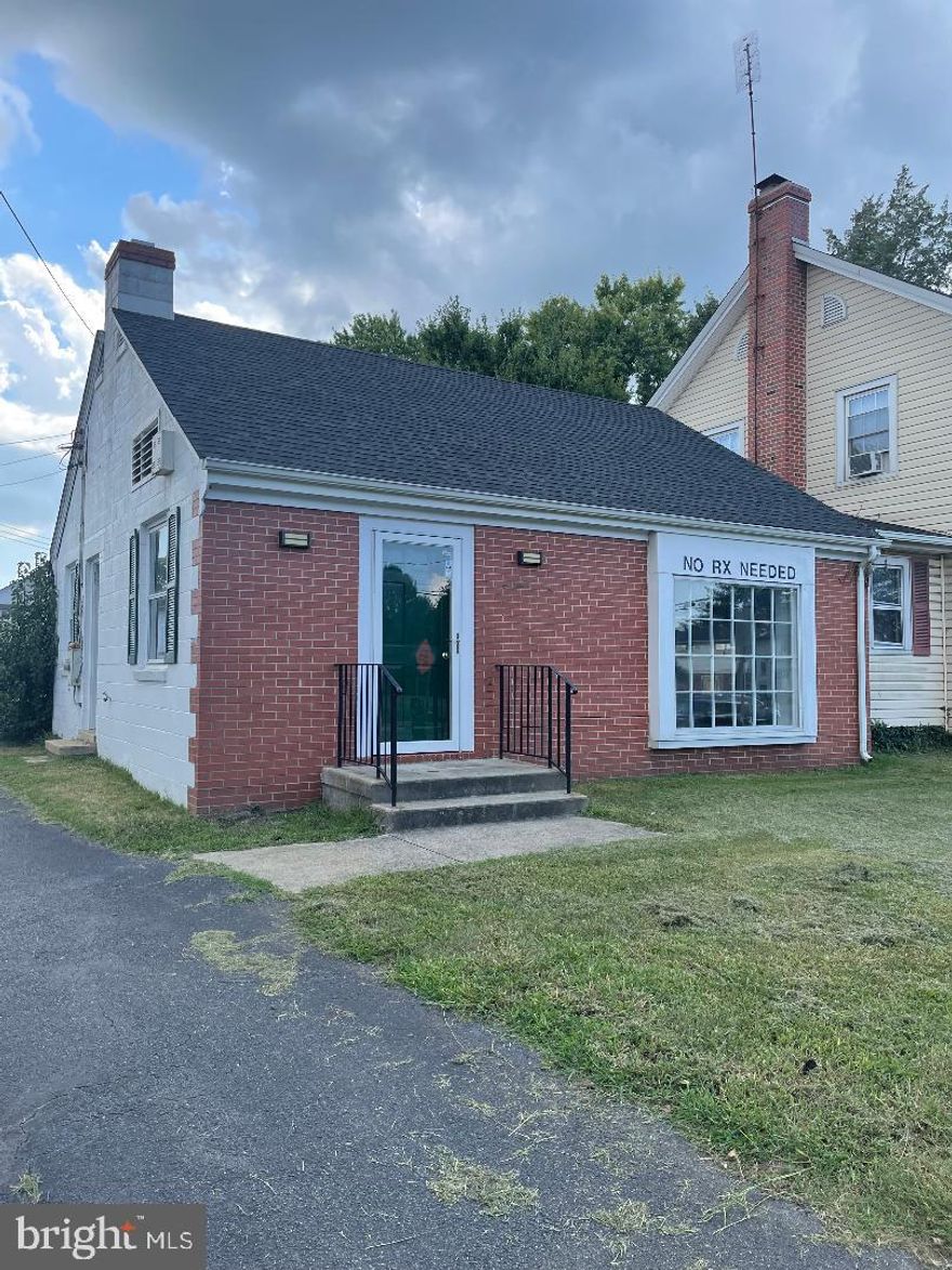 Formally a doctors office. Reception area with built in reception desk, three private rooms /individual sinks. Two  locked storage areas, 2 half baths, Utility room, and small galley kitchen area. Call for details. Parking behind building. Attached home has three bedrooms, one bath. Needs updating. . Call for details. Office is currently leased. Home is empty