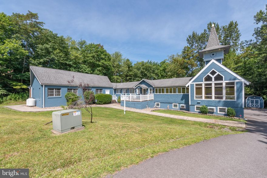 Iconic Lake Access Lodge at Carmel Cove – This one-of-a-kind property at Deep Creek Lake has 10 Primary Suites with an additional 2Bed/2Bath owner’s apartment on the lower level. Privately tucked away on 2 Acres of mature wooded land, you get the secluded feel of a personal mountain retreat with all the comforts of home! Featuring a massive great room with vaulted ceilings, timber accents, and an abundance of natural light. Fully renovated modern kitchen with granite tops, stainless appliances, and butcher block island bar. Breakfast nook on the way to the dining hall with its own stacked stone fireplace, coffee bar, and a wall of glass to let in the surrounding natural beauty. Covered porch off the main living area with private space on the wrap-around deck for each of the main level suites. The peaceful wooded setting for the bonfire pit. The convenient path down to your assigned Dock Slip is right next to the swimming platform in a no-wake cove. A well-established vacation rental, “Carmel Cove” has consistently averaged $100K+ annual rental income (between $100k-$140k over the last four years)! The sky is the limit for any future owner of this phenomenal lake access estate.  Call today for details!