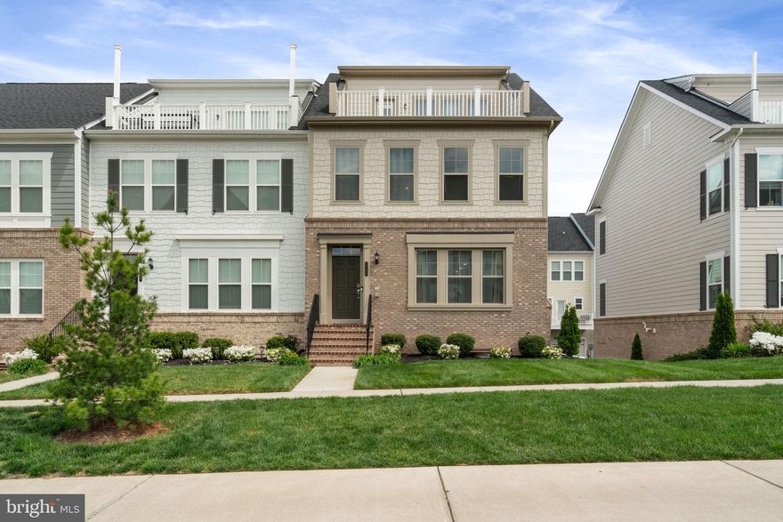 Discover the exceptional four-level Pulte Emerson end-unit townhome, ideally situated in the heart of Potomac Shores—just a short walk to the Jack Nicklaus Signature Golf Course, clubhouse, pools, event barns, hiking trails, and the future town center. This rare traditional townhome offers a flexible lower level with garage access—perfect for a home office, gym, or recreation space. The main level features a bright, open-concept floor plan with expansive sightlines from front to back and a modern kitchen that opens onto a private deck, ideal for entertaining or relaxing. Upstairs, you’ll find a spacious primary suite with a luxury bath, a large walk-in closet, and a conveniently located laundry area—two additional bedrooms and a full bath complete this level. The home's crown jewel is the fourth-floor loft—a stunning flex space bathed in natural light that leads to a rooftop terrace offering sweeping golf course views and breathtaking sunsets. If you’re seeking walkability, elegance, and lifestyle, this is what you’ve been waiting for!