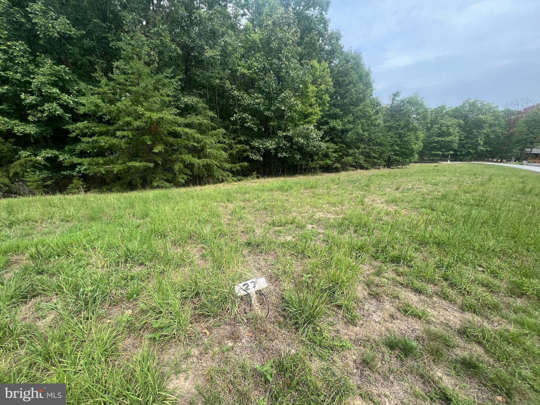 2.08-acre building lot, offering the perfect setting for your dream home. Located in southern Morgan County, this property has a perc test on file at the Morgan County Health Department, simplifying the process of planning your future build. Twin Lakes East also has private community ponds! Whether you're looking to build a primary residence or a getaway retreat, this is an excellent opportunity to create the home you've always wanted.