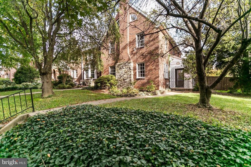 REDUCED! Great opportunity to own a gracious & large 5 BR, EOG center hall colonial on a lovely tree-lined block in Rodgers Forge. Just  blocks from local schools featuring: Lovely side porch, hardwood flrs throughout, Living Room w/FP, large fenced & landscaped rear yd. 3rd lvl BRs w crescent windows & full bath. Detached garage. Side entrance allows for foyer & larger living room. Sold AS-IS.