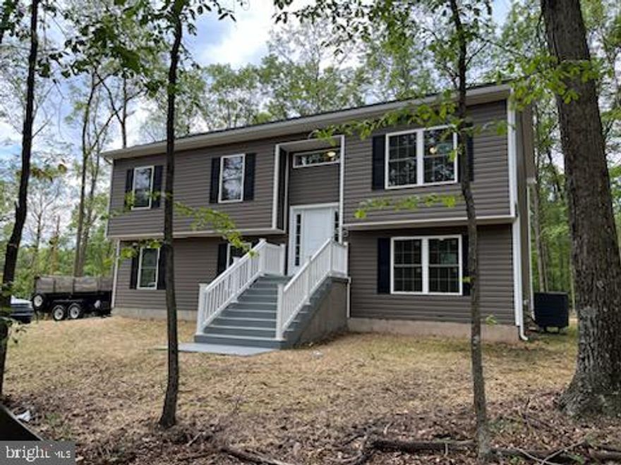 NEW SPLIT FLOYER ON RURAL WOODED LOT 1.49 AC.   JUST GOING UP , 3 BEDROOMS WITH 3 FULL BATHS -1 IN LOWER  AREA WITH FAMILY ROOMAND LAUNDRY UTILITY ROOM -2 CAR GARAGE ON SIDE ENTRY -WITH GARAGE DOOR OPERNERS- NEW STAINLESS APPLIANCES-BUYER CAN AS OF NOW PICK FLOOR COLORS-CABINETS  COLORS- BUILDER WILLING  TO WORK WITH BUYER ON PICKS -FRAMING STARTS IN WEEK -*NOW TIME TO BUY GET HOME TO YOUR PICKS * IF WITH IN BUILDER PRICE  RANGE--GRANITE COUNTER-TOP AN ISLAND.     BUYER  TO PAY TRANSFER STAMPS AND TAX - NO DECK AT THIS PRICE- JUST SHORT HOP TO VA LINE-LIVE ON TREE LOT IN COUNTRY AN TRAVEL TO CITY FOR WORK . WILD AND WONDERFUL