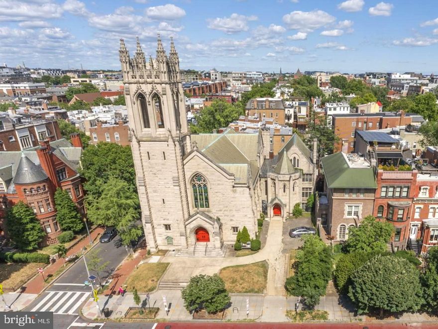 This remarkable church property is a designated historic landmark in the heart of the Sixteenth Street Historic District. With its incredible architecture and dynamic Dupont-Logan location, it is an exciting opportunity for a new congregation, residential development or limited business uses per the RA-4 zoning (such as a school or art gallery). The Sanctuary building with a soaring 44+ foot vaulted ceiling was designed in the Gothic Revival style by renowned architect Langford Warren; the 1894-1896 construction was supervised by Paul J. Pelz, best known as the main architect of the Library of Congress. The stunning stained-glass windows include one from the Tiffany & Co studios; no changes can be made to the windows nor the building exteriors because of the historic status and zoning. The three-level Parish House (South Wing) was added by the same architectural team in 1912. The total building area is 16,150 estimated square feet with a lot size of 9,860 square feet. This active Swedenborgian church has an estimated seating capacity in the Sanctuary of 340; the South Wing has large and smaller meeting rooms for gatherings and services. There were major renovation projects during 2018-2022 including extensive tower repair work, two new 200 amp electric panels, new boilers for radiator heat and the addition of air conditioning (CAC in the Sanctuary and wall AC split units in the South Wing). Off the 16th Street front driveway find parking for up to five cars; there's a wide alley from Corcoran Street at the rear door.
