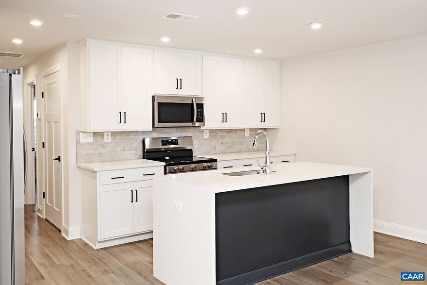 Enjoy a $500 move-in discount when you sign a lease that begins by August 1st! For a limited time, application fees have been waived for this property.  Nestled within the charming community of Crozet, this newly built end-unit Glenbrook apartment features 2 bedrooms, 1 bathroom, and provides access to coveted Western Albemarle Schools. Situated just west of Charlottesville, Crozet offers easy access to Charlottesville, Waynesboro, and Staunton via I-64. Enjoy exploring local shops, inviting cafes, wineries, breweries, and Chiles Peach Orchard. Access Crozet Park through a walking trail, where you can find a pool, athletic fields, a fitness facility, and a dog park.  Built by Greenwood Homes, the 892 sqft lower-level apartment backs up to a permanently private wooded setting and includes luxury vinyl plank flooring throughout, an open living and kitchen area, quartz counters and Frigidaire stainless steel appliances, a primary bedroom with a walk-in closet, a second bedroom, and a hall bath. A stack washer and dryer is included. Ample parking is available in an adjacent lot. Residents can enjoy Glenbrook's playgrounds, fire pit areas, and stunning views of the Blue Ridge Mountains.