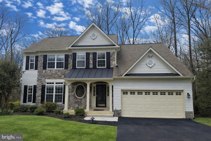 Welcome to 11218 Stonebrook Drive in Manassas — a stunning stone-front single-family home tucked away at the end of a quiet cul-de-sac on a picturesque 1.29-acre lot. Surrounded by mature trees and natural beauty, this farmhouse-chic retreat offers privacy, tranquility, and a peaceful escape from the hustle and bustle of everyday life. The inviting foyer opens to a spacious living area and formal dining room, filled with natural light and accented by gleaming hardwood floors.
     The gourmet kitchen is a chef’s delight, featuring granite countertops, stainless steel appliances, abundant cabinetry, and a large pantry. A sunlit breakfast area provides the perfect setting for morning coffee while overlooking the serene backyard. The cozy family room with gas fireplace creates a warm gathering space, while the oversized sunroom showcases a room of windows with panoramic views of the lush surroundings.
This beautifully appointed home offers 5 bedrooms and 3.5 baths, including a generous primary suite with an updated spa-like bath and two large custom-finished closets. Each additional upper-level bedroom features ample space, plush carpeting, and large windows.
     The fully finished walk-out lower level includes a spacious recreation room, bedroom, full bath, and bonus room—ideal for guests, hobbies, or a home office. Step outside to your expansive, private backyard, perfect for entertaining on the large deck, exploring wooded trails, or simply relaxing in your own backyard sanctuary.
     Conveniently located near shopping, dining, and recreational amenities, this exceptional property offers the perfect blend of comfort, style, and seclusion.