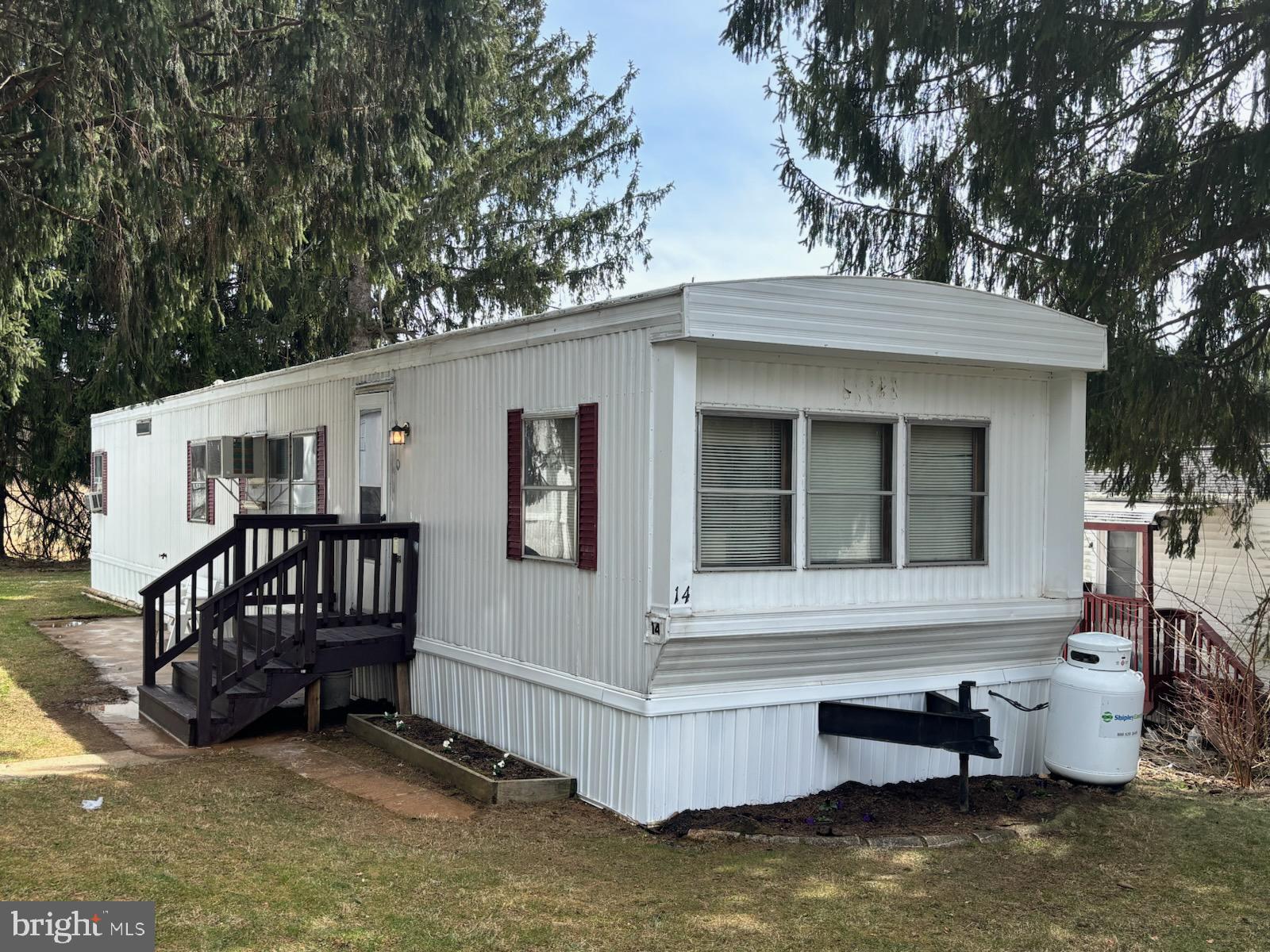 Pre-1976 mobile home is looking for its new owner! This mobile home is located in Park#1 of the quiet Hillandale Homes. It offers 2 bedrooms, 1 bath, new washer and dryer, new refrigerator and small stand-alone freezer in unit. This property is part of an estate sale and is being sold as-is. Buyers are welcome to conduct an inspection, however, no further repairs will be made by the sellers. The unit can be purchased with the furniture – which includes a nice kitchen set, two televisions, sofa and bedroom set. The kitchen is equipped with a gas stove. The unit is heated by propane and is only approximately $100 per month. The mobile home was recently power washed. All park residents are subject to the approval of property management. Property has ground rent of $705 monthly and adjusts yearly. Ground rent includes water, sewer, trash removal 2x's a week and snow removal of the common areas. Residents are responsible for their own yard, ground and property maintenance.