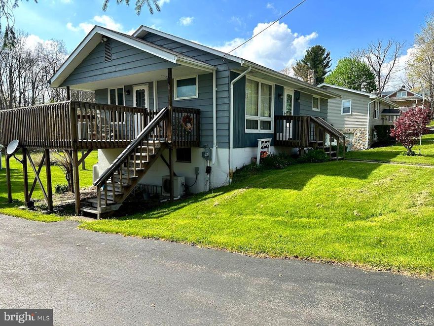 Welcome to this charming 2 bedroom, 1 bathroom house located in the serene town of Mt. Lake Park, MD. Situated on a large lot, this property offers plenty of space for outdoor activities and relaxation. Outside, you'll find a paved driveway and convenient carport, providing covered parking for your vehicles. Don't miss out on this opportunity to make this charming house your new home.