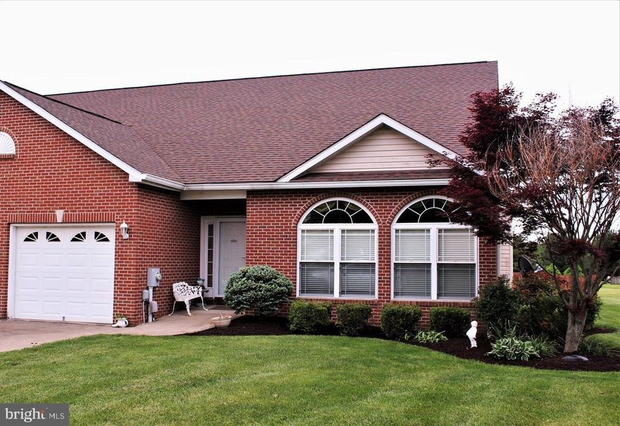 Welcome to this well-maintained brick-front rancher, offering comfort and convenience in a prime golf course setting. This home features a thoughtfully landscaped exterior and a spacious 30x12 non-slip deck with awning, perfect for outdoor entertaining. The fenced backyard provides privacy and plenty of room to enjoy the peaceful views.
Inside, you’ll find gleaming hardwood floors throughout, a propane fireplace, and a vaulted ceiling with recessed lighting in the expansive living room. Both large bedrooms include French doors that open to the rear deck, creating a seamless indoor-outdoor flow.
Primary suite with a walk-in shower and generous walk-in closet
Second bedroom with full bath, tub, and shower
Convenient half bath off the living room plus dedicated laundry area
Additional updates include a 50-year architectural shingle roof (2020), oversized gutters and downspouts, and classic curb appeal with its brick front.
This home combines single-level living with modern updates and a desirable golf course location—ready for you to move in and enjoy.