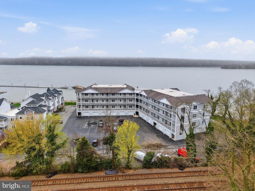 Vacation-style living with breathtaking sunset views every evening!  This rarely available 3 bedroom, 2 full bath Tomes Landing ll Penthouse waterfront corner unit condo with private balcony offers unobstructed views of the Susquehanna River and protected parkland across the river.  Bright, open floor plan with 9' ceilings filled with natural light.  It features a gourmet kitchen with custom cherry cabinetry, granite island, ceramic tile flooring, custom lighting, and two built-in beverage refrigerators in the island.  Kitchen opens to the dining and living areas with all new hardwood flooring. Spacious primary suite has great water views, a luxury ensuite bath, a soaking tub, and a tiled walk-in shower with bench and glass door. Two additional bedrooms with updated Jack and Jill bathroom offer flexibility for guest rooms or office space. In-unit laundry room with tile floor and additional cabinets for extra storage. Rare oversized garage fits up to 3 vehicles, a boat, and/or storage. Building has an elevator plus ample parking. $150,000 in recent updates include expanded living space, new hardwood flooring, lighting, moulding, wainscoting, fresh paint, removal of popcorn ceilings, and new interior fans and porch fan.  Brand new HVAC (April 2026, 1-year service contract) and new 50-gallon water heater (2026).  A swimming pool membership is available for a $100 yearly fee.  Boat dockage and hi and dry is available for an additional fee. Condo fee include water, sewer, exterior maintenance, snow, trash removal, elevator, and flood insurance. Convenient to waterfront dining, shops, and Lee’s Landing; minutes to I-95, Rt 1, Rt 40, Hollywood Casino, and Great Wolf Lodge. Hurry to schedule your private tour today!