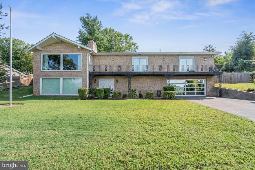 Unobstructed panoramic views of the Potomac River set the stage for this immaculately maintained mid-century contemporary, beautifully sited on a rare .47-acre cul-de-sac lot. A dramatic two-story curved open staircase greets you inside, framed by a striking stone accent wall that showcases the home’s architectural character and sets the tone for the thoughtfully designed interior. From vaulted living room ceilings to the expansive rec room below, the river is a constant, breathtaking backdrop. Designed for both effortless entertaining and everyday comfort, the updated chef’s kitchen features double wall ovens, a gas range set in a large island with vented hood, prep sink, breakfast bar seating, beverage refrigerator, walk-in pantry, and abundant storage. The kitchen flows seamlessly to a covered patio—perfect for barbecues—and opens to generous living spaces ideal for gathering. Four bedrooms are thoughtfully located on the same level. The lower level is made for hosting, with a wood stove insert fireplace, built-in bar/kitchenette, flexible office space, generous storage, and those stunning water views that will make you the go-to host for game nights and holiday celebrations.  Step outside to your private retreat: a professionally maintained swimming pool complete with slide and pool house with private bath, a secure fenced yard, and a separate patio area for relaxing away from the pool. The expansive yard offers flower beds, space for a vegetable garden, and plenty of room to play. Car enthusiasts and hobbyists will appreciate the dream garage with built-in workbench and ample space for a workshop and gardening equipment. The driveway has been recently resealed and provides abundant parking.  Major updates include a new roof (2025), AC and water heater (2023), fresh paint, and new carpet—making this home truly move-in ready.  Enjoy the tranquility of cul-de-sac living just minutes to DC and Alexandria, with easy access to shopping, dining, and entertainment at National Harbor and Tanger Outlets, plus the natural beauty of nearby Fort Foote Park within walking distance. A rare combination of architectural style, thoughtful updates, outdoor amenities, and unforgettable river views—this is the one you’ve been waiting for. The spectacular sunsets are calling.