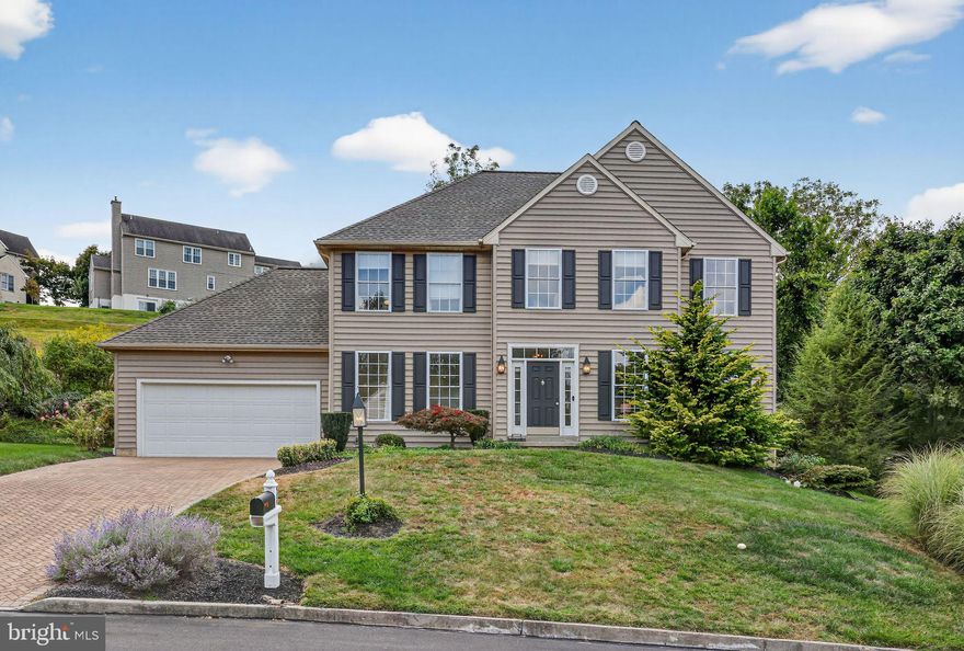 Welcome Home to 959 Garlington Circle, a beautifully updated four-bedroom, two-and-a-half-bath home in the highly desirable Idlewilde community of West Goshen Township. Just minutes from downtown West Chester and within the award-winning West Chester Area School District, this residence offers the perfect blend of lifestyle, comfort, and convenience.
From the paver-brick driveway and newer siding (no stucco) to the updated roof and high-efficiency HVAC system, this home delivers both curb appeal and peace of mind. Inside, you’ll find gleaming hardwood floors, fresh neutral paint, and sun-drenched living spaces.
Pull into the two car attached garage or take the walkway to the front door and into the entry hall. On the right is a spacious living room with hardwood floors and large windows. On the left is a dining room able to accommodate large gatherings. The open-concept kitchen which flows into the great room, featuring white cabinetry, stainless steel appliances, an island, recessed lighting, and a bright breakfast area. It opens seamlessly to the family room with oversized windows and a lovely gas fireplace. Step outside to a private, landscaped backyard with a paver patio—ideal for entertaining or unwinding. a half bath and mudroom lead to the attached garage, completing the mail level.
Upstairs, the spacious primary suite offers a walk-in closet and private bath with a double vanity, soaking tub, and separate shower. Three additional bedrooms share a hallway full bath, and the second-floor laundry adds everyday convenience.
Additional highlights include an attached two-car garage, generous storage, and a full unfinished basement with endless potential.
Combining timeless style with modern upgrades in a prime location, with easy access to everything that the Borough has to offer, this home is a unique opportunity.