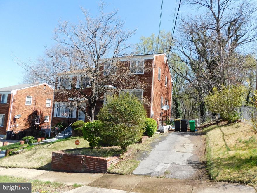 Just reduced $10,000!! Make an offer today! This rarely available Oxon Run Hills semi-detached all brick home is ready for a new tenant! You are greeted by beautiful hardwood floors on the main level when entering into the sun-filled living room. Hardwoods flow through the dining room which is adjacent to the galley kitchen which features granite counters, stainless steel appliances, and access to the huge backyard. Stairs to the basement level split with a half bath at the landing.   The wide-open lower level is perfect for relaxing, game room, or theater room. Utilities, laundry, and storage space area are also found on this level. Upper-level features 3 bright bedrooms with hardwood floors and a full bath. Driveway for 2 cars plus ample street parking. Conveniently located close to shopping and major commuter routes - Routes 5, Capital Beltway, and Suitland Parkway. Write an offer today while rates are still relatively low and settle into your new home for the holidays.