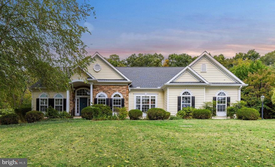 Live authentically. A serene driveway leads you to a spectacular gem nestled within a perfect storybook setting in the coveted Hereford zone. A picturesque rancher thoughtfully improved throughout the years. Revel in the vaulted ceilings, gleaming hardwoods and wonderful workmanship throughout. Welcome the cooler evenings by getting cozy beside the stone-stacked fireplace in the expansive family room that flows easily into the kitchen. Peacefully sip your morning coffee beside the wall of windows. Find sanctuary in your space and surroundings. Host your family and friends in the elegant dining room. Convenience at your fingertips with one level living. Enjoy the beautiful and brightly lit lower level with a guest suite and walk-out to the lush backyard. Delight in the changing seasons from your own back deck. Several improvements made by the Seller include the installation of a new roof, new gutters and gutter guards, a new furnace, a new tankless hot water heater, new kitchen aid appliances, new garage doors, a new whole-house water filter and so much more. An opportunity not to be missed. Xfinity Internet. Cultivate your existence. The art of uniting human and home.