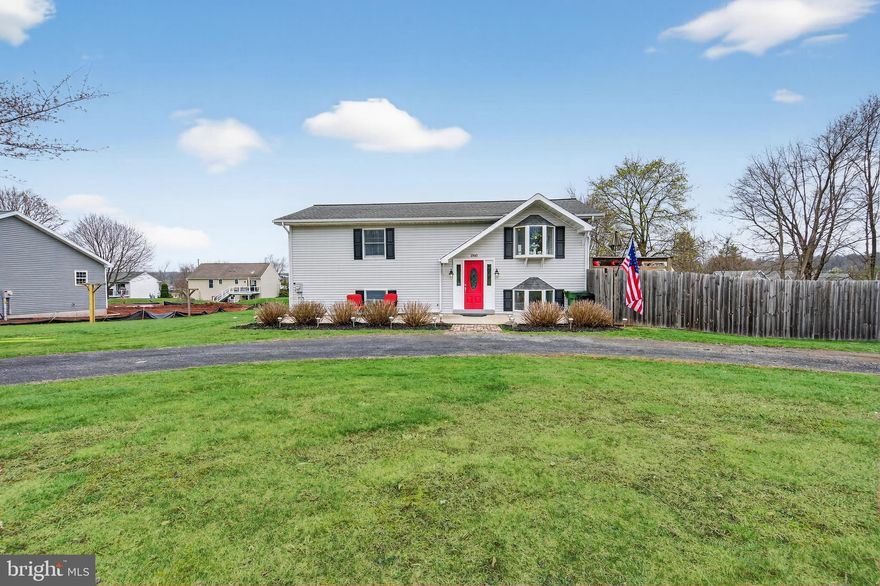 This lovely lake community home has much to offer both inside and out! A semi-circular driveway offers ample parking and leads to a spacious, concrete front patio. The foyer, connecting the home’s two levels, begins with a soaring cathedral ceiling which continues into the open concept living area featuring an updated eat-in kitchen whose center island gently divides it from the spacious living room. Sliding glass doors access a marvelous deck. This level also offers a full hall bath, laundry room, and two spacious bedrooms each with a walk-in closet, the latter also boasting a half-bath ensuite. Downstairs you begin with a wonderful L-shaped family room, with backyard access, on to a second full bath and an additional two, spacious bedrooms. While one bedroom offers cozy wall-to-wall carpeting, the majority of the lower-level features beautiful ceramic tile flooring! The home’s double lot presents an expansive front yard as well as a marvelous, privacy fenced back yard with its two sheds and play area, beautifully captured form the upper-level deck! Set in the community of Lake Wynonah, amenities abound in its pickleball and tennis courts, clubhouse, pool, and more! A bonus, this secluded lake community puts you within an hour’s drive of both the Reading and Allentown areas! Don’t miss an opportunity to call this wooded, gated community home!