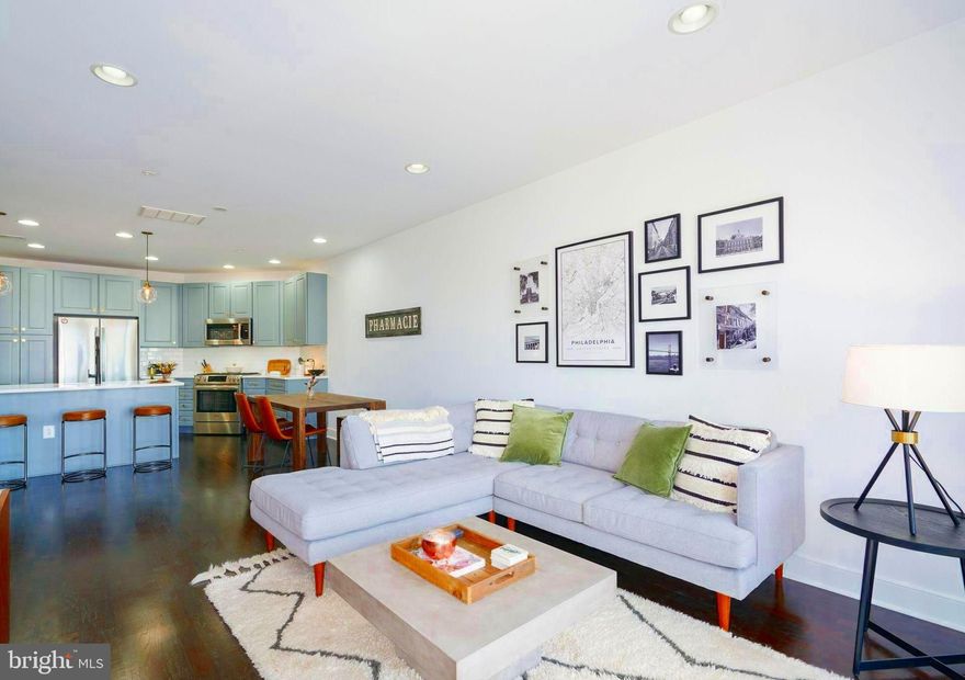 Welcome to this beautiful and meticulously maintained one bedroom, 1 bath condominium with PARKING in the highly desirable boutique building 2400 South. The contemporary, open floor plan features beautiful hardwood floors and walls of windows. The chef's kitchen offers new quartz countertops, updated lighting fixtures, gas cooking, ample storage space and a large island that's perfect for entertaining. The living area showcases floor to ceiling sliding doors with incredible city views. The large bedroom offers wonderful light, wood flooring and a walk-in closet.  The board has approved plans and budget for an updated entry area - no assessment.  For those that are fitness buffs, there is an onsite gym. The bike path, playground and dog park are all within easy walking distance. Quick access to South St Bridge to University of Penn, CHOP, HUP & Drexel University. Enjoy the finest restaurants, cafes & nightlife located in Fitler & Rittenhouse Square.