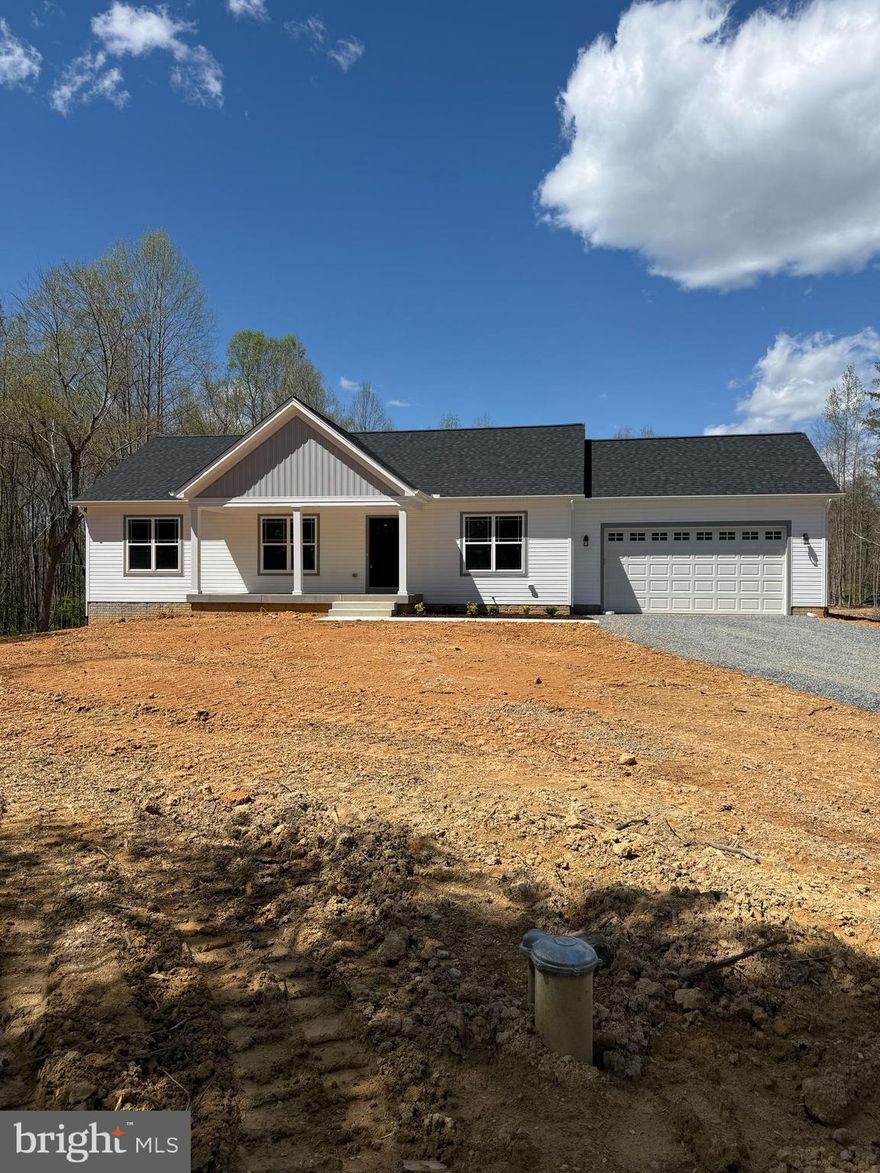 WOW over 5 acres with a pond!!! Brand new ranch home with Fully Finished basement and a 2 car Oversized garage on 5.21 acre private lot with no HOA and minutes to Lake Anna. Over 2,700 sqft. finished and this home is loaded with Upgrades! Open floor plan with vaulted ceilings, tons of recessed lighting and Luxury Vinyl Plank flooring throughout main level living area. Black matte hardware and plumbing fixtures throughout the entire home, 2 panel doors, ceiling fans in all the upstairs bedrooms and more. The gourmet kitchen features white shaker style cabinets, stainless steel appliances, tons of cabinet and counter space with upgraded granite tops, large center island with pendent lighting and breakfast bar. The owners suite has a spacious walk in closet as well as owner's bath with dual vanities, ceramic tile flooring and an oversize custom ceramic shower with glass doors. Main level laundry room that has a laundry tub sink, built in cubby storage and additional storage. Downstairs you find a fully finished walk out basement with a 3rd full bath, bedroom/study, office, rec room, game room, and utility room. Concrete front porch, 10' x 14' deck with stairs , patio and painted foundation. Fifth bedroom not to code. All this and much more! Schedule your showing today!