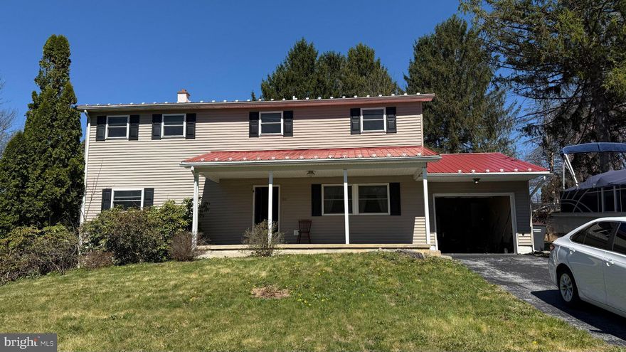 Tucked away in the quiet Spring View neighborhood of Houserville, just minutes from downtown State College, this beautifully maintained home offers space, comfort, and charm in equal measure. Major renovations completed in 2021 enhance both style and functionality throughout. Step inside to a warm and inviting family room that flows seamlessly into a bright, updated eat-in kitchen and a sunroom filled with natural light. The kitchen features granite countertops, a large island, stainless steel appliances, and cabinetry—perfect for cooking and gathering.

The main floor includes two bedrooms and a full bath, ideal for guests or one-floor living. Upstairs, you’ll find two expansive primary suites, each with its own private bath and walk-in closet. The finished lower level adds even more versatility, featuring a spacious recreation area, bonus room, and a full bath.

Enjoy outdoor living rain or shine on the generous covered front porch or back patio overlooking a low-maintenance perennial garden. Additional features include central air, hardwood floors, a range, a basement carpet, and a water softener.The attached garage and storage shed provide ample storage.

Located near Spring Creek Park with tennis courts, ball fields, and scenic walking trails just around the corner, this home truly combines convenience and tranquility. Come experience all that 242 Spring Street has to offer!