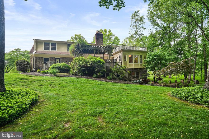 Offers are due on Friday 24th at 3pm.Welcome to 14900 Spring Meadows Drive, a magnificent residence in Darnestown, MD, where every detail has been thoughtfully considered, creating a truly remarkable living experience. This exceptional property, constructed by WC & AN Miller, has received over $100,000 in upgrades, including designer lighting, bathroom fixtures, appliances, insulation, landscaping, and more!

Encompassing over 5500 square feet across three levels, this home features 4 bedrooms and 4.5 bathrooms, providing ample space for comfortable living. Upon entry, you are greeted by gleaming hardwood floors that guide you through the light-filled living spaces. The heart of the home is the expansive open family room and kitchen, featuring incredible views, deck access, and a wood-burning fireplace with stone surround, creating a warm and inviting ambiance for relaxation and entertainment. The kitchen is a haven for culinary enthusiasts, featuring high-end appliances, generous counter space with seating, ample cabinetry, and a walk-in pantry. The home also offers a separate dining room and living room, ideal for hosting casual gatherings or elegant dinners. A fully renovated powder room, large mudroom with custom built-ins and two car garage complete the main level.

The hardwood floors continue upstairs where you'll find four sizeable bedrooms, including a luxurious primary bedroom suite featuring a built-in window seat with bookshelves and a walk-in closet with custom storage system. The en-suite bathroom includes a two-person steam shower, double vanity and separate water closet. Each additional bedroom is generously sized, ensuring comfort and privacy for family and guests.

The large windows continue in the walkout lower level where you'll enjoy high ceilings, plush carpeting and an abundance of space including a library with built-in bookshelves and cabinetry, a home office or gym, a full bathroom, and multiple additional areas for recreation and leisure.

Outside, the almost 4 acre property is enhanced by meticulously landscaped grounds, offering a tranquil and private outdoor oasis.  Enjoy dinner on the elevated deck under the pergola or roast marshmellows in the built-in firepit on the patio. The expanded yard provides ideal play space while the two-story fort, woods and creek offer unlimited adventure.
 
Situated in the highly sought after Spring Meadows community, this home provides privacy and convenience, being close to a wide range of amenities including Darnestown Swim & Racquet Club, Potomac Village, The Kentlands, Downtown Crown & Rio, Rocklands & Windridge wineries as well as to key commuter routes.