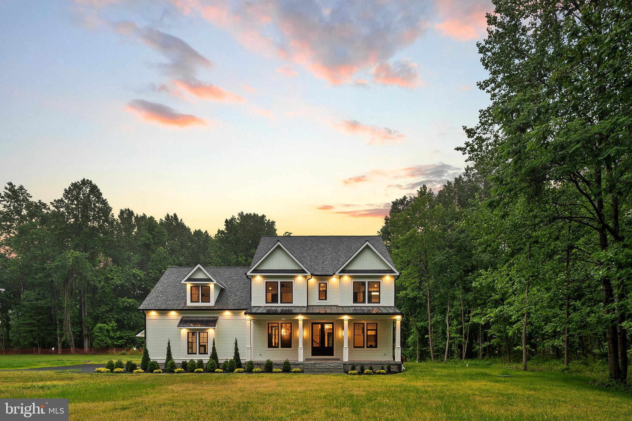 The One That Outshines Them All—Near Downtown Annapolis
This stunning newly built colonial home is a true showcase of thoughtful design and refined craftsmanship, beautifully situated on 1.34 acres with no association fees to limit your lifestyle. From the rich French white oak flooring and custom stair railings to the intricate glass doorknobs and solid wood doors, every detail has been lovingly chosen. The chef’s kitchen is both stylish and functional, featuring white cabinetry with distinctive hardware, whimsical lighting, and a walk-in pantry complete with a sink and illuminated shelving. Spanning four thoughtfully planned levels, the third floor hosts five bedrooms, including a serene primary suite with an attached bath, as well as an oversized laundry room with custom cabinetry, work space, and a utility sink. The top level offers flexible space ideal for an au pair suite, while the fully finished lower level includes a rec room, full bath, bedroom, and walk-up access to the backyard. Car lovers and tinkerers alike will appreciate the three-car finished attached garage with soaring two-level ceilings, offering space for vehicles, hobbies, and storage galore. Located just minutes from downtown Annapolis—Maryland’s capital filled with charm, history, waterfront dining, and the U.S. Naval Academy—and with easy access to Routes 50 and 97, this home delivers elegance, space, and freedom in one exceptional package.