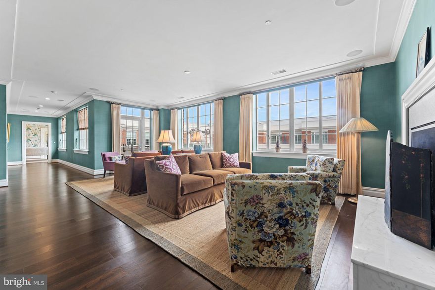 Welcome to The Signet!  Experience the pinnacle of luxury living in this stunning penthouse condo. Spanning 2884 SQFT, #706 has 2 Bedrooms + Den, 2.5 Bathrooms + custom built-ins and a sophisticated Savant and Lutron control system..... Professionally decorated to perfection by renown New York interior design firm, McMillen. Lightly lived in by current owners, outstanding features include an octagonal entry foyer, walls of windows, two- sided fireplace between family room and living room and separate gas fireplace in large den/ library. The two bedrooms are located at opposite ends of the home offering complete privacy and access to separate private balconies...... A chef's dream kitchen boasts top of the line Thermador appliances, walk-in pantry, wine cooler, "Architessa" tile backsplash and a large island with marble waterfall counter. ......Luxury amenities include full-service concierge, 24/7 front desk, on-site maintenance engineer, private fitness center with professional equipment, sauna, steam room, yoga room and doggie spa. The gorgeous common area club rooms open to a private landscaped courtyard, lushly landscaped with 4 lounge  areas, a fire pit area with seating and a trellis covered outdoor bar and grilling area, all perfect for outdoor relaxation..... There are three designated parking spaces in an underground garage and additional storage on the 7th floor. ....Situated in the heart of McLean, owners enjoy access to the  McLean Metro, superb  shopping, dining and outdoor activities. With unparalleled elegance throughout, this is penthouse living at its finest.