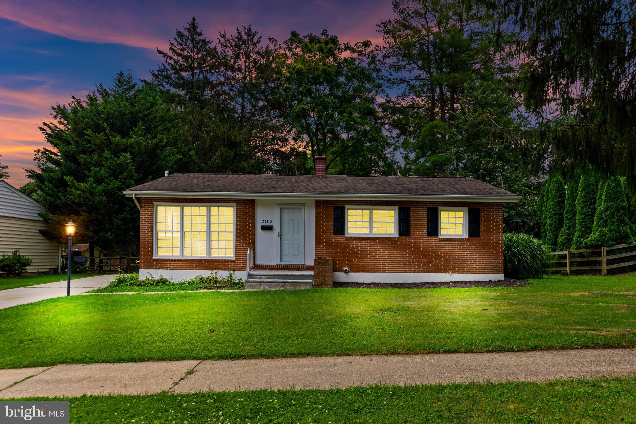 Welcome to 2103 Pine Valley Dr—an updated 3-bed, 2-bath Timonium rancher, offering roughly 1,900 ± sq ft of climate-controlled living space (main level + finished lower level plus a fully finished, heated & cooled sunroom that brings the outdoors in year-round).
Inside, gleaming natural hardwoods, fresh paint, and oversized windows flood the living room with light. The renovated eat-in kitchen pairs granite counters with stainless appliances and gas range. Perfect for weeknight dinners or Saturday brunch.
Slide open the rear doors and step into the show-stopper: a four-season sunroom wrapped in windows, separately ducted for heat & A/C! Morning coffee, playroom, peloton studio—this flexible space elevates daily living and adds true square footage you’ll feel every day.
Three main-level bedrooms share an upgraded hall bath with custom tile. The bright, walk-out lower level adds a huge rec room, full bath, laundry and storage—ideal for movie nights or guest space.
Outside, a patio overlooks the level, partially fenced yard—great for grilling or letting the dog roam. Big-ticket peace of mind: central air, a supplemental ductless mini-split, efficient gas heat and newer water heater. All on a quiet, sidewalk-lined street feeding coveted Pinewood ES and moments to I-83, Towson & Hunt Valley shopping, and Loch Raven trails.
A turnkey rancher + sunroom bonus? Schedule your showing before it’s gone!