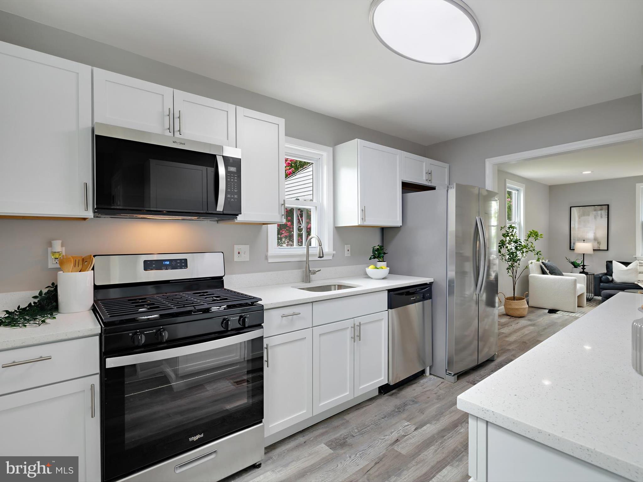 This is your opportunity to own this 3 Level Cape Cod, boasting 3 Bedrooms and 2 full Bathrooms. The beautiful interior showcases contemporary finishes and a thoughtful layout that maximizes both style and functionality. The custom kitchen with quartz countertops, stainless-steel appliances and attractive cabinetry enhances your cooking and gathering experience. Complete with a traditional floor plan and modern finishes that will WOW you the moment you walk through the door. The bathrooms have been tastefully refreshed adding modern elegance to this classic home. Freshly painted, new carpet and laminate wood plank flooring throughout. The expansive yard provides the perfect setting for outdoor activities, entertainment, and a place for pets to play in the rear fenced yard. Conveniently located close to Fine Dining, Fun Eateries, Nightlife Entertainment and major routes. Schedule today !!