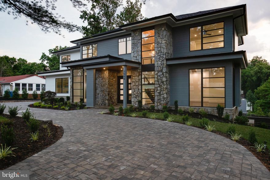 Presenting 1508 Brookhaven Drive, a luxurious residence situated on a large premium lot in the Brookhaven neighborhood. This home boasts dramatic windows throughout flooding the living space with natural light and walls of windows in the main and lower levels overlooking a serene setting. The open concept floor plan has an executive office on the main level, Miele appliances in the grand gourmet kitchen, and a large deck of the family room with access to a screened-in porch. The primary bedroom suite has private access to a rear deck, spa like bathroom, morning bar, and a vast walk-in closet with ample built-ins. The lower level offers a very large recreation room with walkout access to a rear patio, full wet bar with beverage center and wine refrigerator, exercise room, and a large game room. Spacious ensuite bedrooms, ample storage and closet spaces, side loading 3 car garage, and great outdoor entertaining spaces with plenty of room to expand for further recreational purposes are just some of the features this gorgeous home offers.