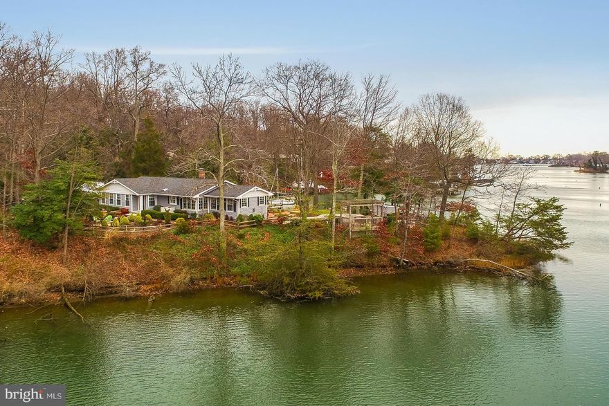 A Valentine's Day present that keeps on giving! Imagine owning your own 400' waterfront peninsula, private dock steps away (4.5mlw), heated pool, beautiful landscaping, bright and sunny, very tastefully decorated, 2 car garage, one level living, completely remodeled. 4 bdr, heated master ba floor, 3.5 ba, gourmet kitchen, formal dn rm, great rm, all with views! Ll au pair suite.