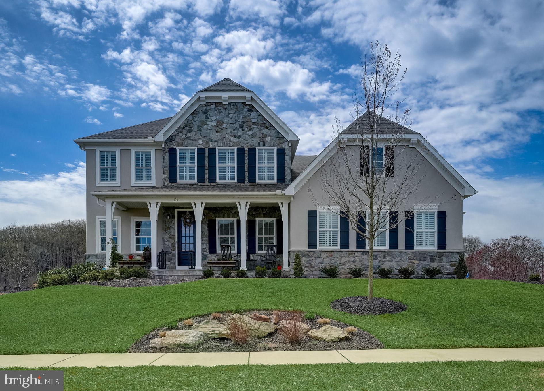 Welcome to 133 Parkview Way, where luxury living meets breathtaking views in the coveted Ventry Community at Edgmont Preserve. A stunning custom-built Nottingham model boasts 4 bedrooms, 3.2 baths, and over 3900 square feet of meticulously crafted living space, offering an unparalleled retreat nestled amidst the serene landscape of Ridley Creek State Park. Step onto the inviting front porch and into a world of elegance, where hardwood floors grace the expansive first and second levels. Discover a private home office with French doors and a charming breakfast room adorned with wainscoting, perfect for enjoying morning moments. Indulge your culinary desires in the chef's kitchen, adorned with custom cabinetry, Viking appliances, granite countertops, and a convenient island with seating. A butler’s pantry with wine storage is ideal for dinner parties. Entertain in style in the two-story family room, featuring soaring ceilings, a two-sided fireplace, and panoramic vistas of Ridley Creek State Park. Retreat to the expanded primary suite, complete with two large walk-in closets and a spa-like ensuite bathroom boasting dual vanities, an oversized walk-in shower, and a luxurious soaking tub. Upstairs, three spacious bedrooms await, each with walk-in closets and access to a hall bath as well as one ensuite. The partially finished walkout lower level offers endless possibilities for recreation, with space for an exercise room, playroom, or home theater. Step outside to the expansive deck, where a covered area and fireplace create an inviting outdoor oasis for relaxation and al fresco dining. The lower level patio features a built-in grill, perfect for hosting summer gatherings against a backdrop of professionally landscaped grounds and sweeping views. With main floor laundry, a mudroom, and ample storage throughout, this exceptional home offers the ultimate blend of luxury, comfort, and convenience. Experience the pinnacle of suburban living at 133 Parkview Way – your sanctuary awaits.