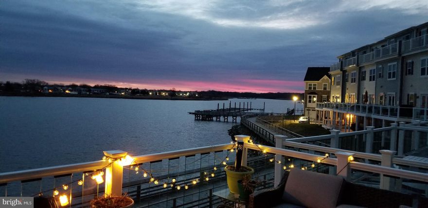 This is more than a home—it’s a lifestyle. Nestled in the sought-after waterfront community of Sheltered Harbor, this expansive four-level townhome with smart home features offers 2,450 sq. ft. of luxurious living space with five bedrooms, four full bathrooms, and a half bath—perfect for multi-generational living or hosting guests. The gardens have been intentionally planted to sprout lush perennials and bananas trees in season.



Wake up to breathtaking sunrises over the water, right from your bedroom window. Enjoy morning coffee or unwind in the evening on any of the three private decks overlooking Bear Creek and Lynch Cove. With multiple levels of thoughtfully designed space, this home provides both privacy and functionality.



The open-concept main level is designed for entertaining, featuring a gourmet kitchen, spacious living areas, and abundant natural light. Retreat to the primary suite with panoramic water views, a spa-like ensuite, and ample closet space.



A Boater’s Paradise



Sheltered Harbour offers direct water access and an attached marina, making it ideal for boating enthusiasts. Whether you enjoy fishing, sailing, or cruising along the Chesapeake Bay, this community provides the perfect setting. Dock your boat just steps from your front door and take advantage of the marina’s convenient location, giving you easy access to Bear Creek, Lynch Cove, and beyond.



Scenic Waterfront Living



Embrace an active lifestyle with the waterfront boardwalk, perfect for jogging, walking, or simply taking in the serene water views. Start your mornings with a refreshing run along the shoreline or enjoy a peaceful evening stroll as the sun sets over the harbor. With miles of scenic pathways, you’ll have the perfect blend of relaxation and recreation right outside your door.



Boating, kayaking, and waterfront dining are just moments away, making every day feel like a vacation. Don’t miss this rare opportunity to own a waterfront retreat that truly revives the soul!