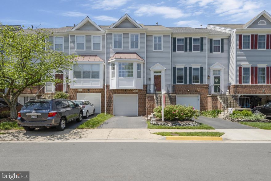 Welcome to an exquisite townhouse nestled in the heart of Clifton, Virginia, offering peaceful tree views with modern conveniences close by. This home is a rare find – where Clifton townhomes are few and far between, this rarely available home is one of the only townhomes featuring two primary bedrooms with ensuite baths and oversized closets! Each upper-level, ensuite bath features dual sink vanities too!  Additionally, the lower level, equipped with an ensuite bath, can effortlessly transition into a third primary bedroom, perfect for guests or extended family members. The lower level features a gas fireplace and walk-out to the private patio facing the scenic woods—if you’re looking for multi-generational living potential or perhaps an au pair suite, this home is your dream set-up!

Entertain effortlessly on the oversized deck, seamlessly connected to the patio via stairs, while enjoying the serene backdrop of lush woods. With a south-east facing orientation, natural light floods the home, accentuating its spacious layout and oversized bedrooms.

The updated kitchen boasts new stainless steel appliances complementing the granite countertops and new kitchen tile. The kitchen boasts amazing natural light and plantation shutters accent the kitchen windows. The adjacent dining room easily seats six and flows into the HUGE living room featuring hardwood floors and the home’s second gas fireplace. A half bath is on this level too!

This home features a one-car garage with additional driveway parking along with an extra deep storage closet so all your storage and parking needs are covered. Like to entertain? Ample guest parking spots are located directly facing the unit too! With 2 bedrooms and 3.5 baths, ample guest parking, and an affordable HOA fee of $100/month, this townhouse presents a rare opportunity to experience luxurious suburban living at its finest. Schedule your showing today!