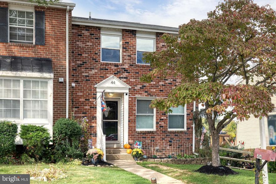 Don’t miss this end-unit brick front townhome with a fully fenced backyard and dual outdoor spaces, including upper and lower decks! Inside, the main level is highlighted by stylish, low-maintenance luxury vinyl plank flooring and an updated half bath. The spacious living room flows into a dining area and beautifully renovated kitchen featuring new ceiling-height white cabinetry, a large stainless-steel refrigerator (2023), matching microwave and stove, a chic backsplash, and a pantry for extra storage. Step through the slider to the new composite deck (2024)—perfect for grilling or relaxing. Upstairs, you’ll find all-new carpet, fresh paint, and three generously sized bedrooms with ample closet space. The full bathroom was refreshed in September 2025 for a modern feel. The finished lower level offers a versatile second living space with updated flooring (2023), a half bath (2022), washer and dryer (2023), and walkout access to the new lower deck and patio (September 2025). Major updates give peace of mind, including the roof (2022) —ready for you to move right in!
