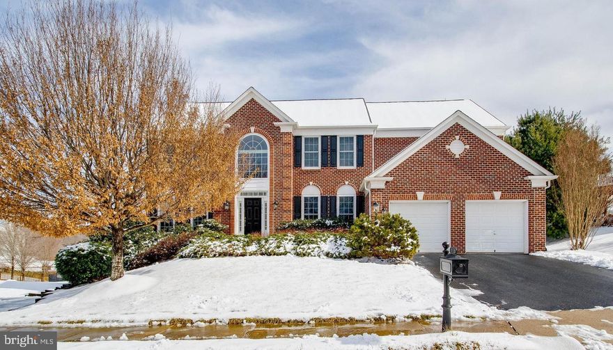 ABSOLUTE PERFECTION!  Gorgeous 4BR, 4.5BA SFH with STATELY brick front on .27-acre in White's Mill! AIRY & OPEN floor plan boasts 3 fully finished levels with no details left untouched! GLEAMING HDWDs on most of the main level & front staircase!  Inviting entry with SOARING 2-Story Foyer!  Chef's Delight Gourmet Kitchen features GRANITE, ample 42" cabs, S/S appliances, EXPANSIVE island, tile flooring & more!  Large Family Room with COZY gas FP & convenient BACK STAIRCASE to Upper Level!  Private Study!  Master Bedroom Retreat with DRAMATIC tray ceiling & SUN-DRENCHED Sitting Room opens to Luxury Master Bath! 3 FULL BAs UPSTAIRS! Bedroom 2 with Full BA En Suite!  Bedroom 3 with HUGE W/I closet & private entry to Hall Bath.  GIGANTIC Finished LL with SUNLIT walk-out stairs, Game Room, Rec Room w/WET BAR, Den/5th Bedroom, & Full Bath! Spacious open-air DECK overlooks fenced backyard! NEWER ROOF - Spring 2017! Other updates include: neutral carpet, fresh paint & more!