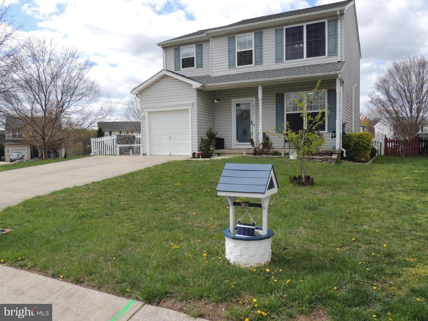 This well-maintained colonial welcomes you with a charming covered front porch. The original one-car garage has been thoughtfully converted into a versatile storage area and office, providing additional living space.
Situated on a desirable corner lot adjacent to a community common area, the property feels expansive and open. Inside, the main level features a spacious living room with luxury vinyl plank (LVP) flooring and a large double window that fills the space with natural light. A convenient coat closet and half bath are located just off the living room. The large living room & eat-in kitchen offer an open floor plan perfect for entertaining.
The generously sized eat-in kitchen offers ample cabinet and counter space, along with a sliding glass door that leads to the rear deck—perfect for indoor-outdoor living. Adjacent to the kitchen is the converted office space, ideal for remote work or study.
Upstairs, you'll find three beautifully appointed bedrooms and two full bathrooms. The primary suite comfortably accommodates full bedroom furniture and includes a walk-in closet and private ensuite bath featuring a double vanity, a luxurious soaking tub, and a separate tiled shower.
The lower level offers a cozy family room complete with a fireplace, perfect for chilly evenings. This level also includes a third full bath with a tiled shower, a separate laundry room, and walk-out access to the backyard.
The fully fenced backyard is a standout feature, boasting a spacious deck with a covered section—ideal for entertaining, relaxing, or enjoying time outdoors.