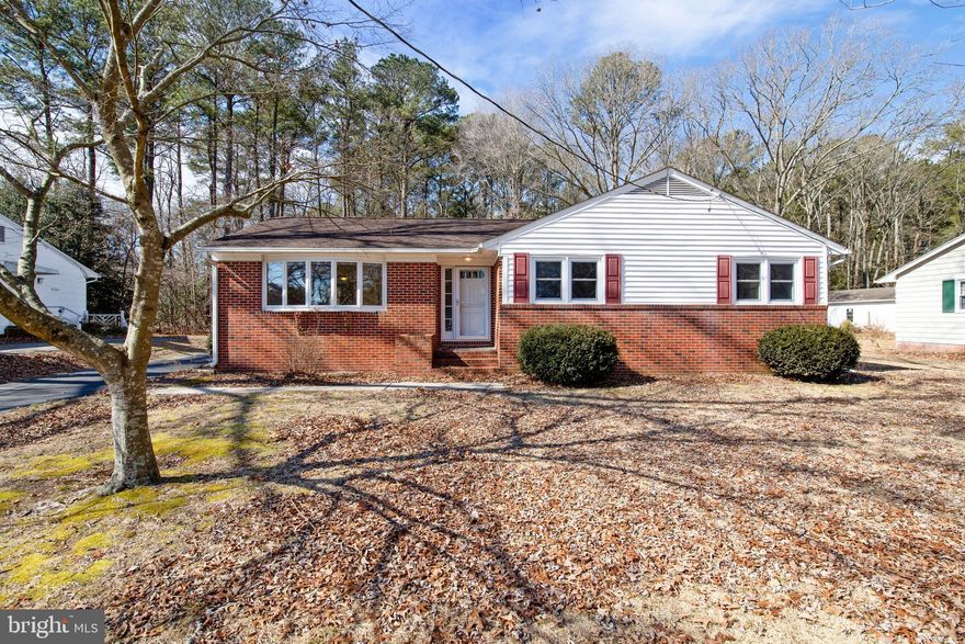 Spacious and well loved One Owner Home being sold for the Estate of Dianne Haskell.   Just under 1900 sq ft of 1 story living, on a quiet and private 0.63 Acre lot that backs to woods and just a few houses away from Coulbourn Mill Pond.  Oversized 2 car detached garage building and lots of paved parking area.  Pre-Inspected to ease the process for buyers. Sold AS-IS to settle the estate, with the inspections available to buyers (Home and Septic Inspections).   This home was originally a 3 bedroom, 2 bath rancher with a traditional floor plan. The owner had a beautiful addition added 2 years ago to the rear of the home dramatically expanding the living space, including creating a nice open plan from the kitchen to the new large family room featuring built in shelving, sliding door access to the rear deck, and adding a large  bedroom.  The new living space and bedroom feature luxury vinyl plank flooring.  With 4 BR and 2 BA, this home has a spacious yet cozy feel and offers a 2nd large formal living room or den, separate dining room (both with hardwood floors), and a well proportioned kitchen open to the new family room.  The original section is home to a master bedroom with it's own full bathroom, 2 additional bedrooms and a hallway full bath.  Off the rear family room is an oversized bedroom with large closet.  A full unfinished basement provides incredible expansion and storage space, and includes a pool table, and the washer and dryer.  A professionally installed french drain & sump pump system was installed to ward off any water concerns.  The side basement walls have experienced some settling which was also addressed in 2017 with a structural carbon fiber strapping system.  An engineer's report is available regarding evaluation of that system.  Heat Pump was installed in 2009 to replace original furnace.  Windows have been updated.  Original septic permit for 3 BR. Inspections and Engineers report are attached to the listing for review or can be requested to be sent via email.  Excellent location in town very close to Salisbury University, PRMC, and just a couple minutes to the By-Pass for access to Rt. 50 , Rt. 13 or quick 30 minutes to Ocean City! No City Taxes either! If you want a quiet but convenient location this is perfect!