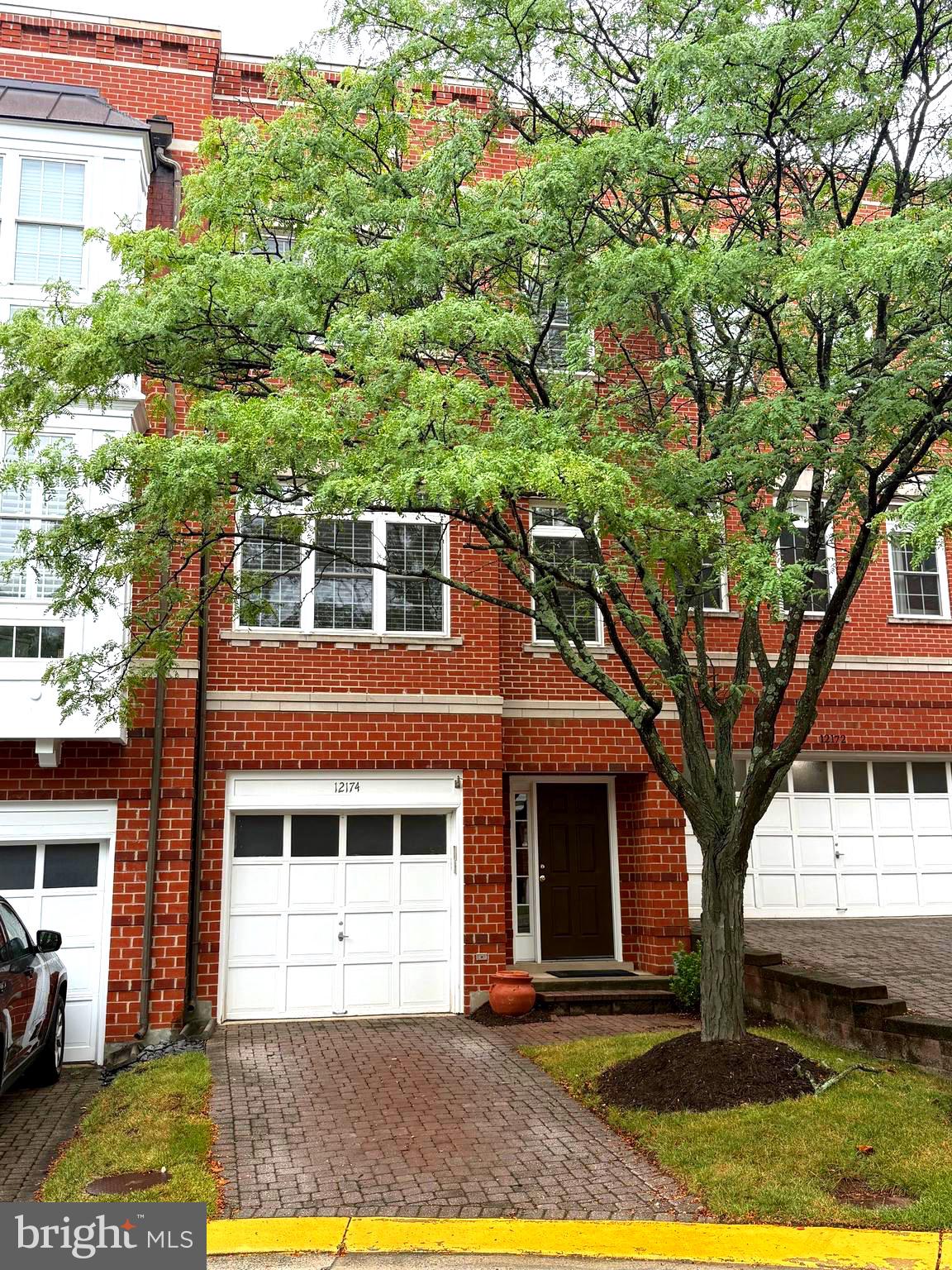 Welcome to 12174 Chancery Station Circle—an exceptional four-level townhome in the sought-after West Market community, just steps from the heart of Reston Town Center.
Located in a charming all-brick enclave, this elegant residence offers the perfect blend of classic architecture and modern urban convenience. Enjoy the vibrant lifestyle of Reston Town Center right across the street—dining, shopping, entertainment, and nightlife are all just a short stroll from your front door. Commuting is effortless with the Reston Metro Station, Reston Hospital, and major commuter routes all within easy reach.
Inside, the thoughtfully designed layout offers open-concept living filled with natural light. The main level features a spacious kitchen with an island, flowing seamlessly into the dining and family rooms—a perfect setup for daily living or entertaining. On the entry level, you’ll find a tiled foyer, full bathroom, access to the garage, and a flexible bedroom or office with direct access to the private brick patio.
The third level includes two generously sized bedrooms, each with its own ensuite bathroom, plus a conveniently located laundry area. The top floor is a showstopper—featuring a large bonus room with a wet bar, beverage cooler, gas fireplace, and built-in shelving, leading to a stunning rooftop deck with panoramic views of Reston’s skyline.
Enjoy unbeatable walkability to the W\&OD Trail, walking paths, parks, shopping, dining, and more. With Dulles Airport just minutes away, this location offers the ideal balance of suburban comfort and city-style convenience.
If you're seeking a sophisticated lifestyle in the heart of Reston, this home delivers. Welcome to West Market living.