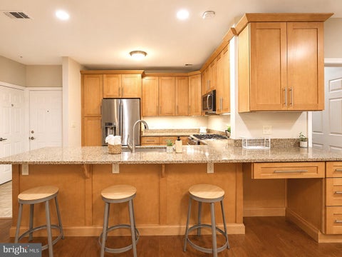 Photo of 1701 Lake Shore Crest Drive #21, RESTON, VA 20190 (MLS # VAFX2328484)